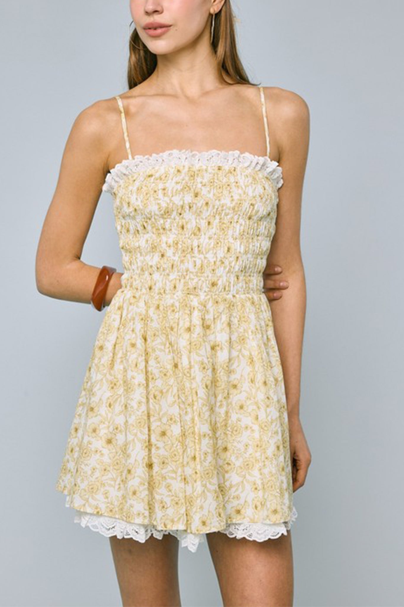 Floral lace mini dress from Larrea Cove, capturing boho elegance with intricate lace details in a fresh, coastal vibe.