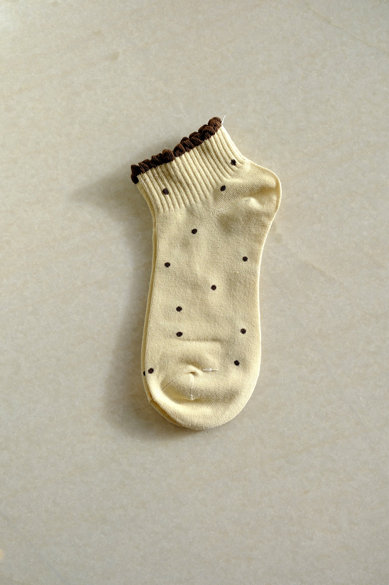 Light brown polka dot socks from Larrea Cove, blending playful charm with boho style for new arrivals collection