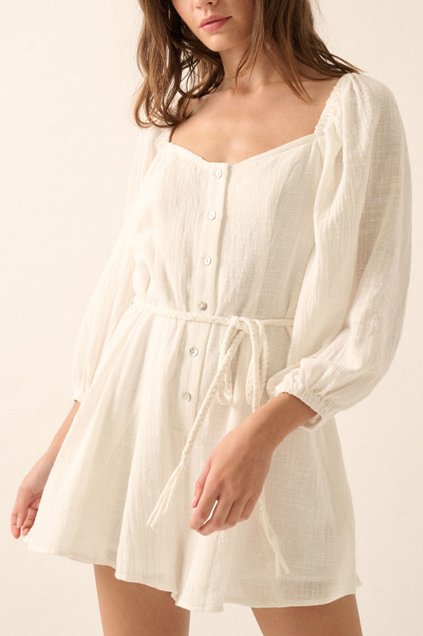 Larrea Cove's bubble sleeve romper in a soft hue, combining boho charm with modern flair for coastal adventures.