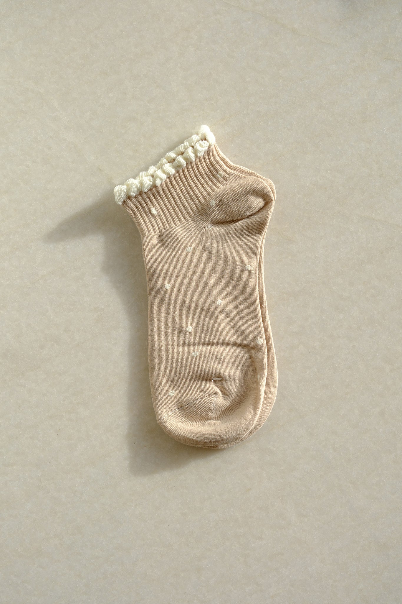 Khaki polka dot socks from Larrea Cove's new arrivals, blending playful boho charm with cozy coastal elegance.