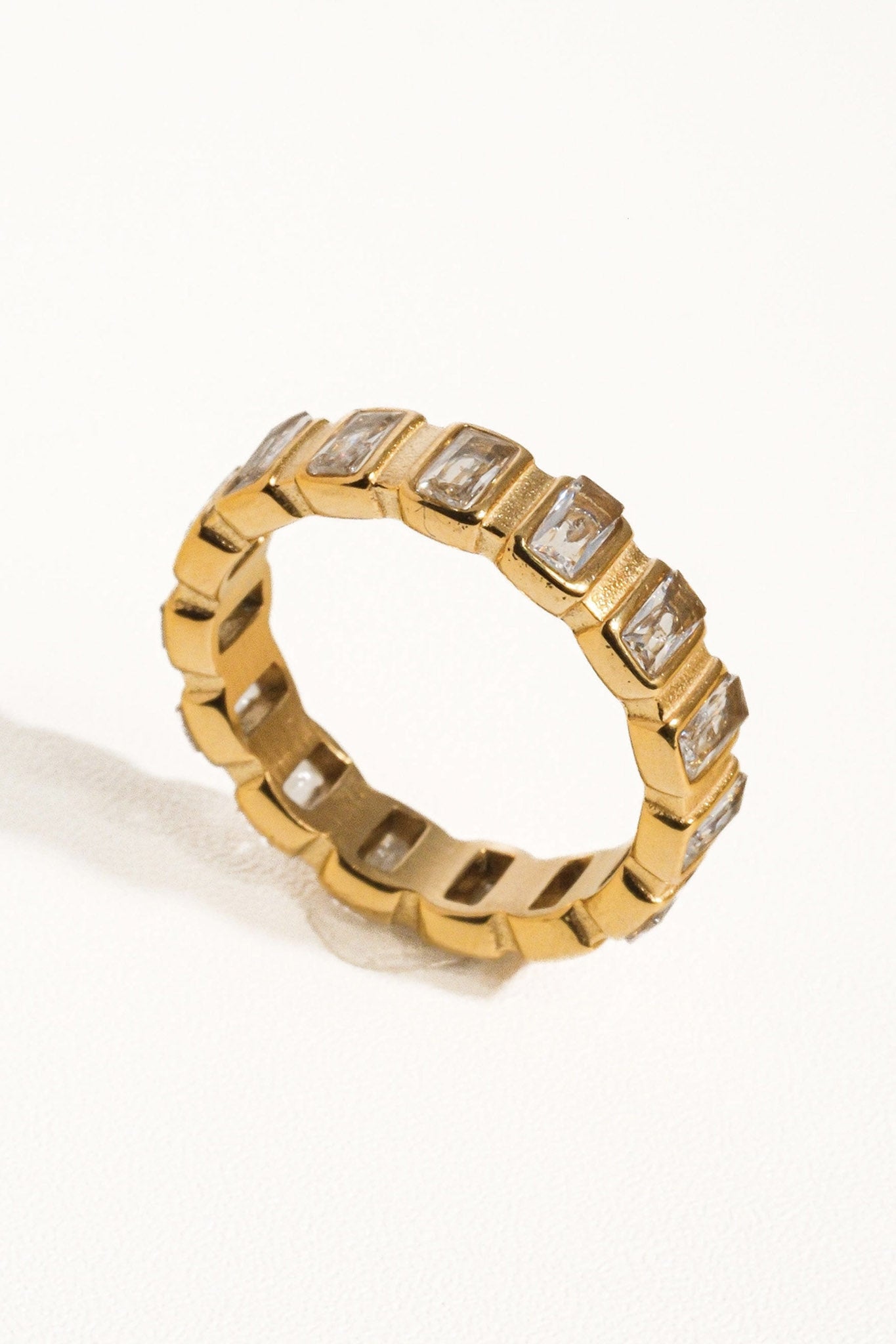 Larrea Cove baguette stone eternity band, a timeless jewelry piece from new-arrivals, captures boho elegance with sparkling allure.