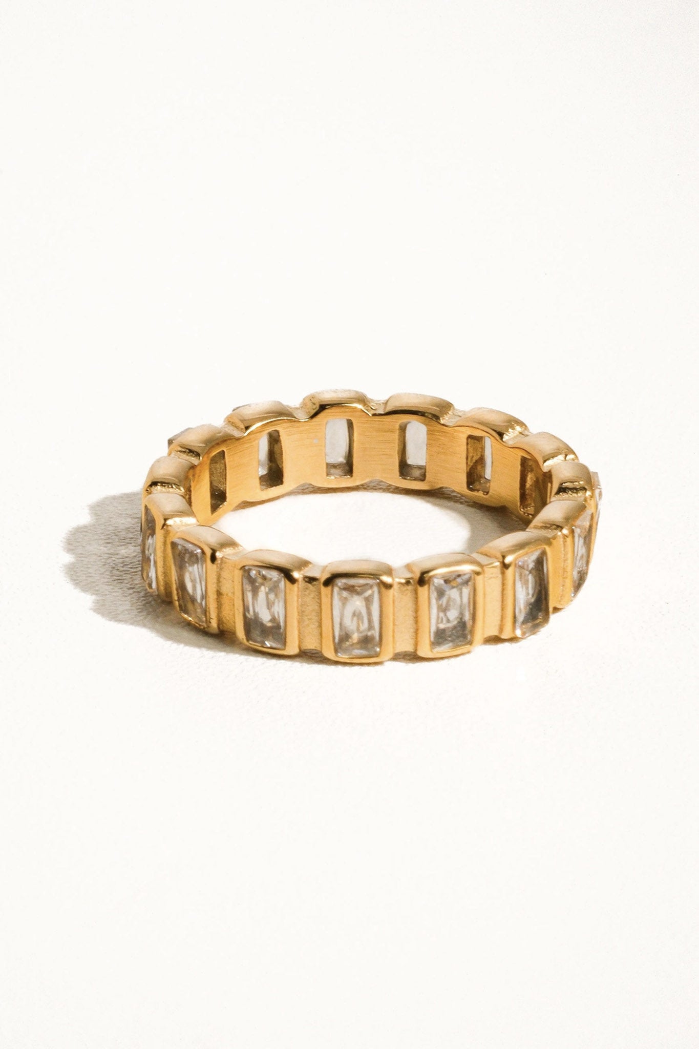 Elegantly crafted baguette stone eternity band from Larrea Cove's new arrivals, shimmering with timeless sophistication in our jewelry collection.