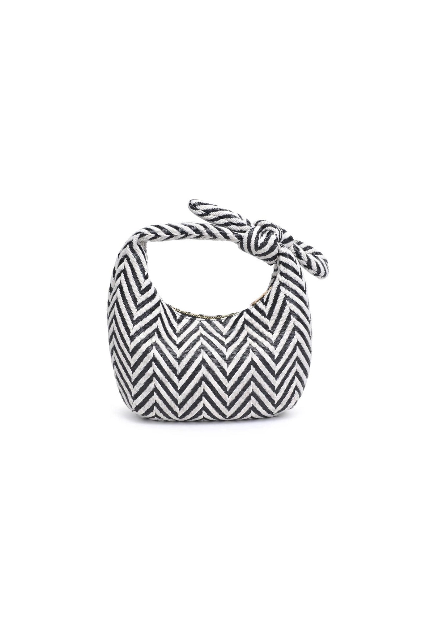 The Penny Clutch from Larrea Cove, a boho accessory featuring natural textures and coastal charm, perfect for new arrivals and bags collections.