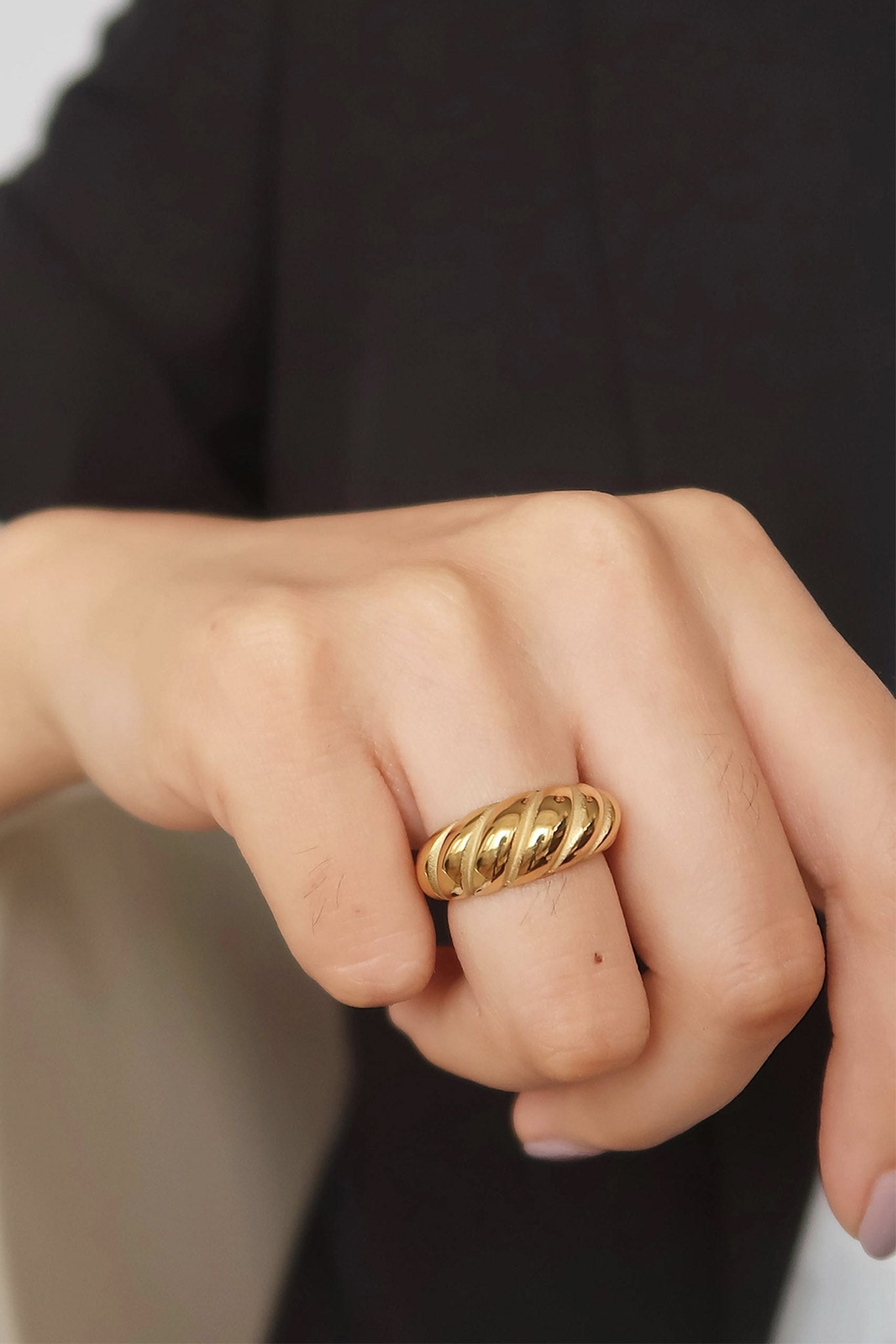 Larrea Cove's golden croissant ring, an exquisite jewelry piece from our new arrivals, perfect for boho coastal vibes.