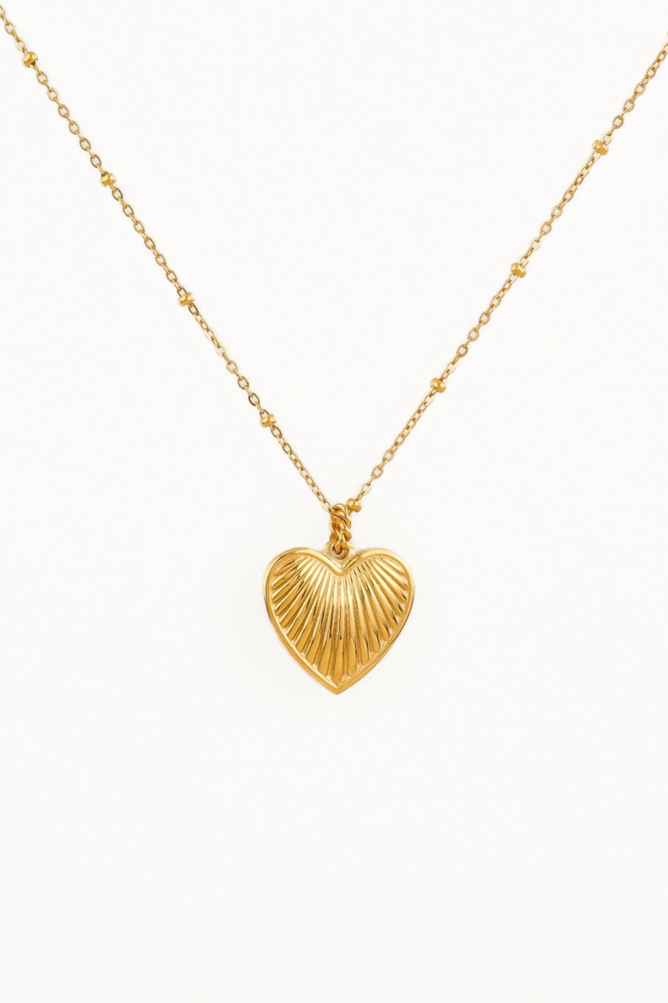 18K gold dainty heart necklace gleams with elegance from Larrea Cove's new-arrivals jewelry collection, perfect for a boho coastal vibe.