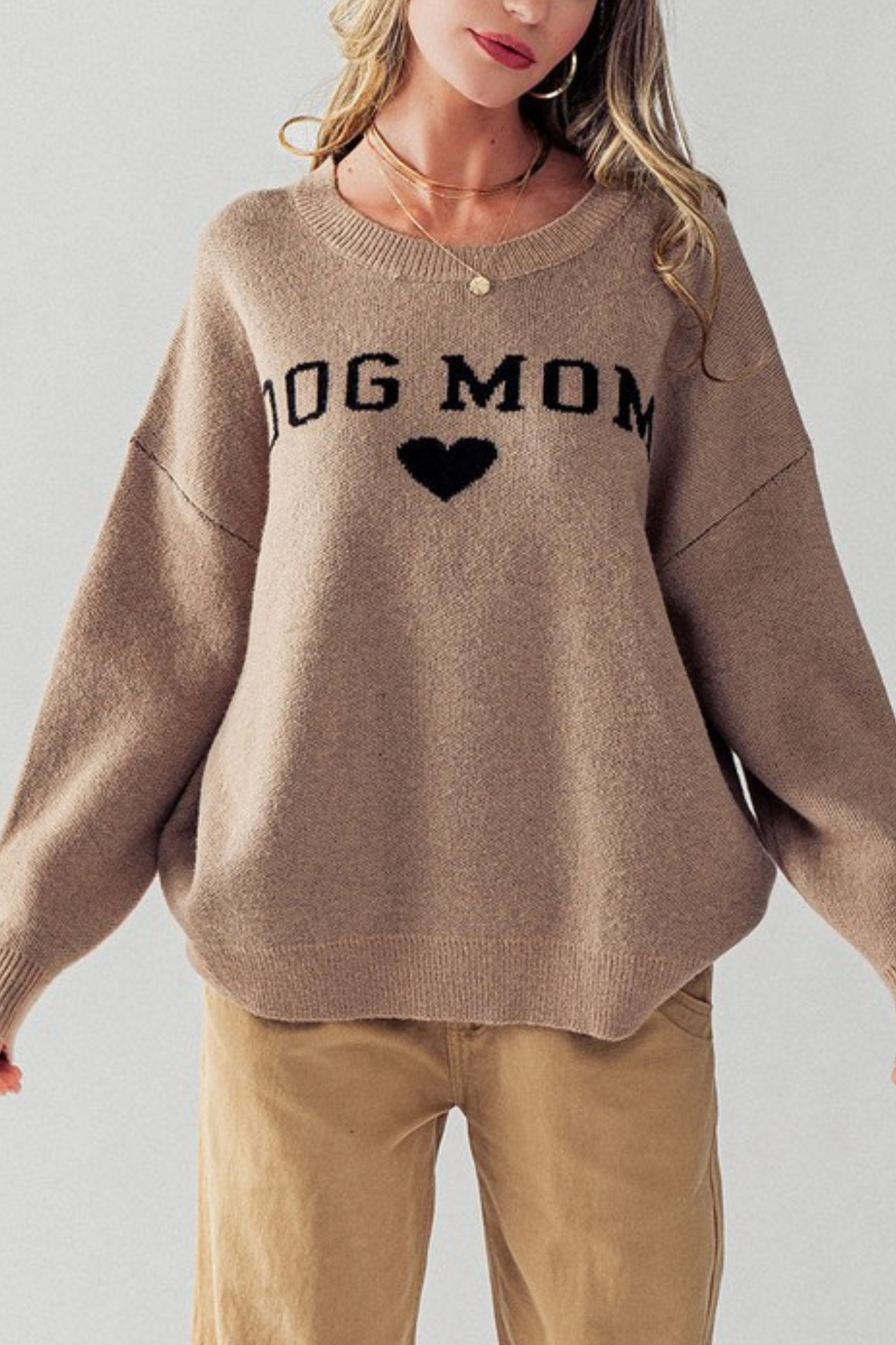 View 1 of Dog Mom Pullover in Taupe, a Sweaters from Larrea Cove. Detail:
Features:
Super s...