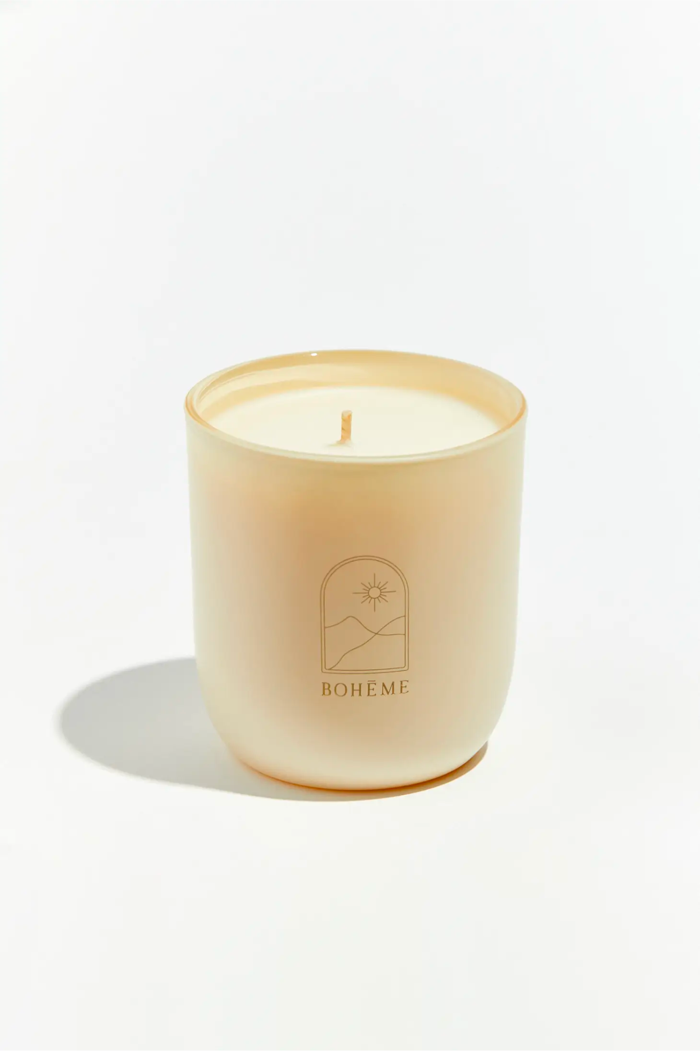 Boheme Arabia Candle by Boheme, featuring an elegant design suitable for home decor. The candle is displayed alongside a pair of stylish sunglasses, highlighting a chic lifestyle. Ideal for home fragrances, this product is categorized under candles.
