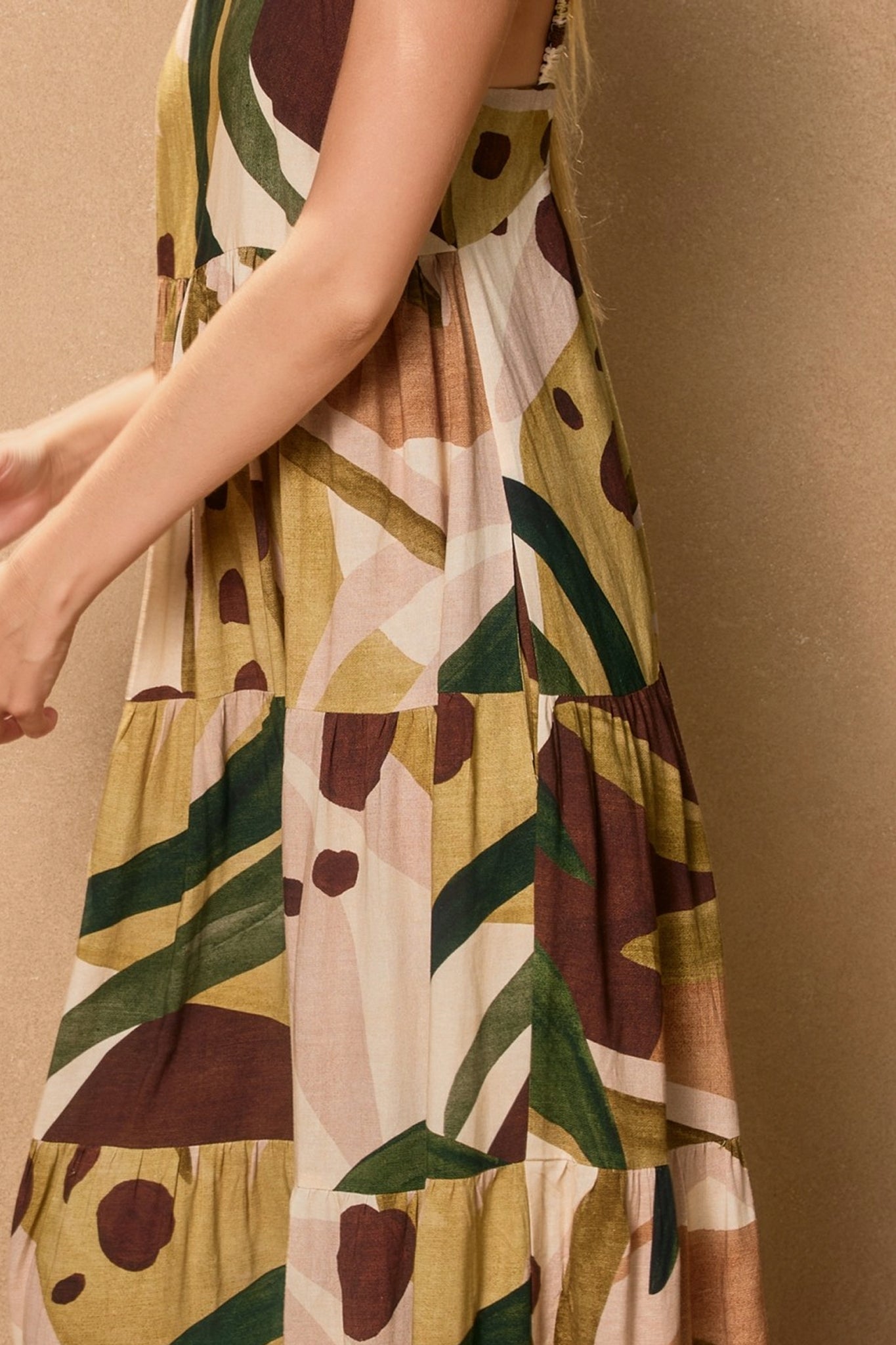 The Margo Babydoll Tiered Maxi Dress in a flowing silhouette, perfect for a boho coastal vibe from Larrea Cove.