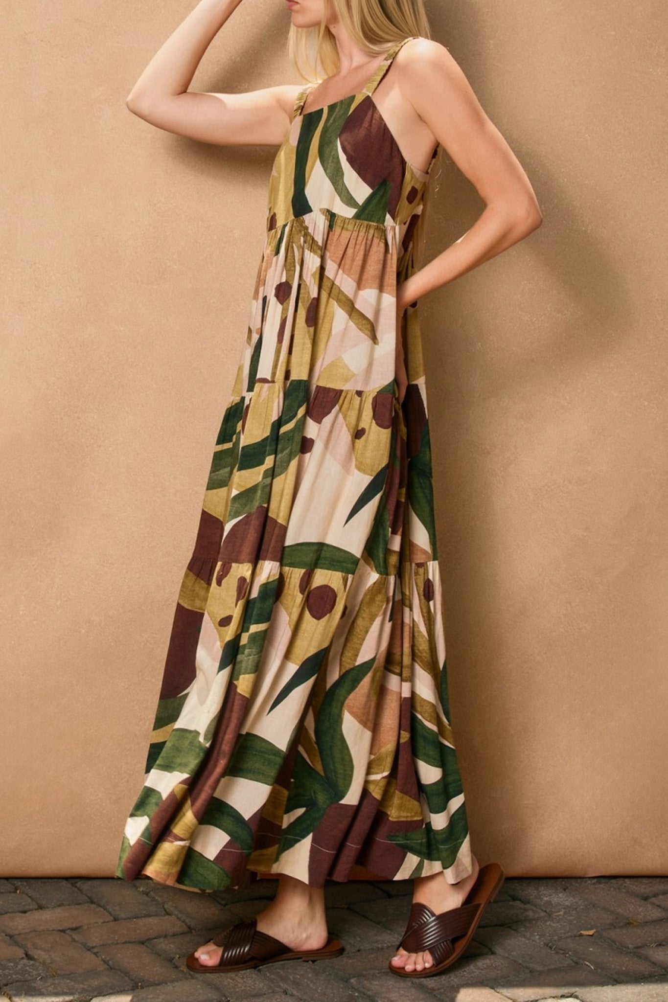 Embrace bohemian elegance with Larrea Cove's Margo babydoll tiered maxi dress, a dreamy addition to your coastal wardrobe.