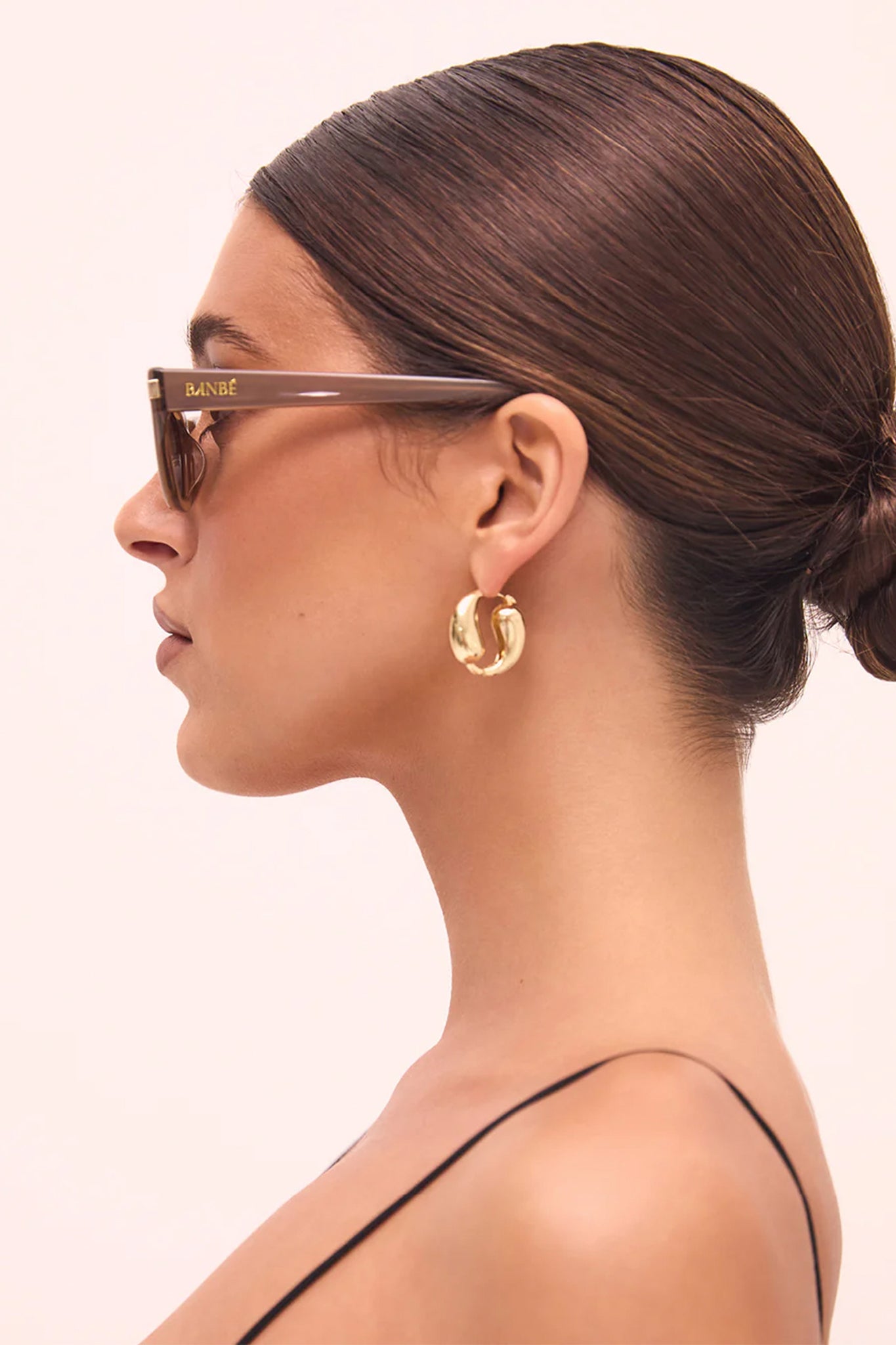 The Watson in taupe brown, a boho-chic accessory from Larrea Cove's new arrivals, exudes earthy elegance and timeless style.
