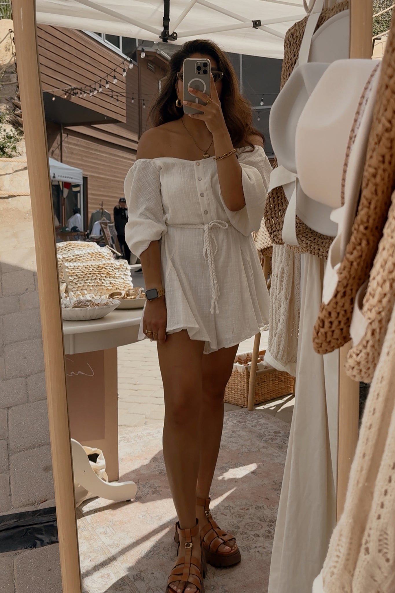 Larrea Cove's bubble sleeve romper in a soft, coastal hue, perfect for a breezy boho beach day.