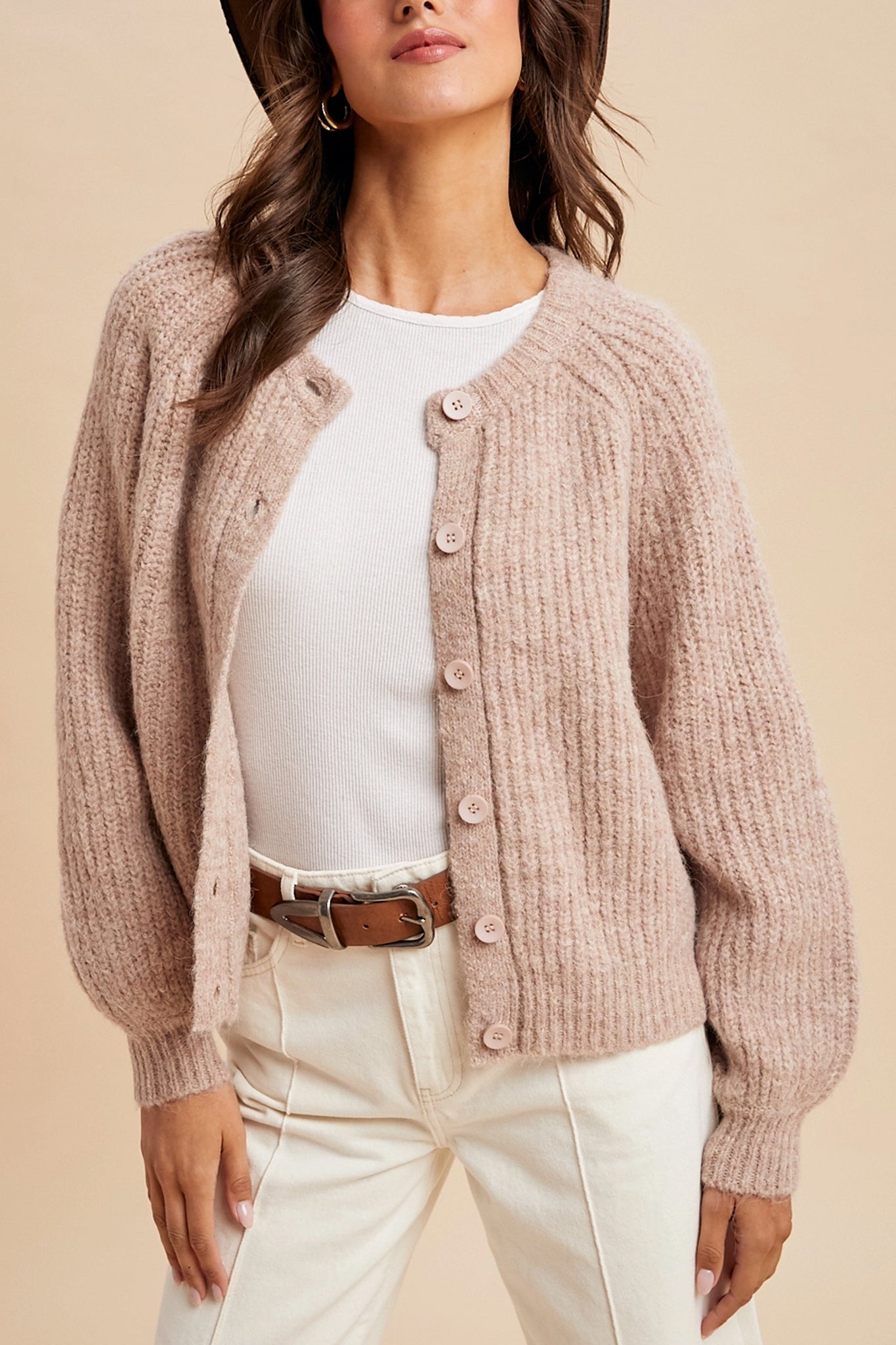Embrace the boho coastal vibe with Larrea Cove's dusty rose knit cardigan, a cozy addition to the outerwear collection.