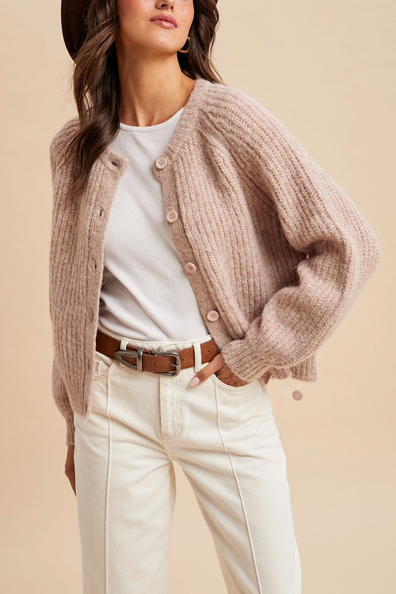 Embrace the cozy boho vibe with Larrea Cove's dusty rose knit cardigan, perfect for layering in coastal breezes.