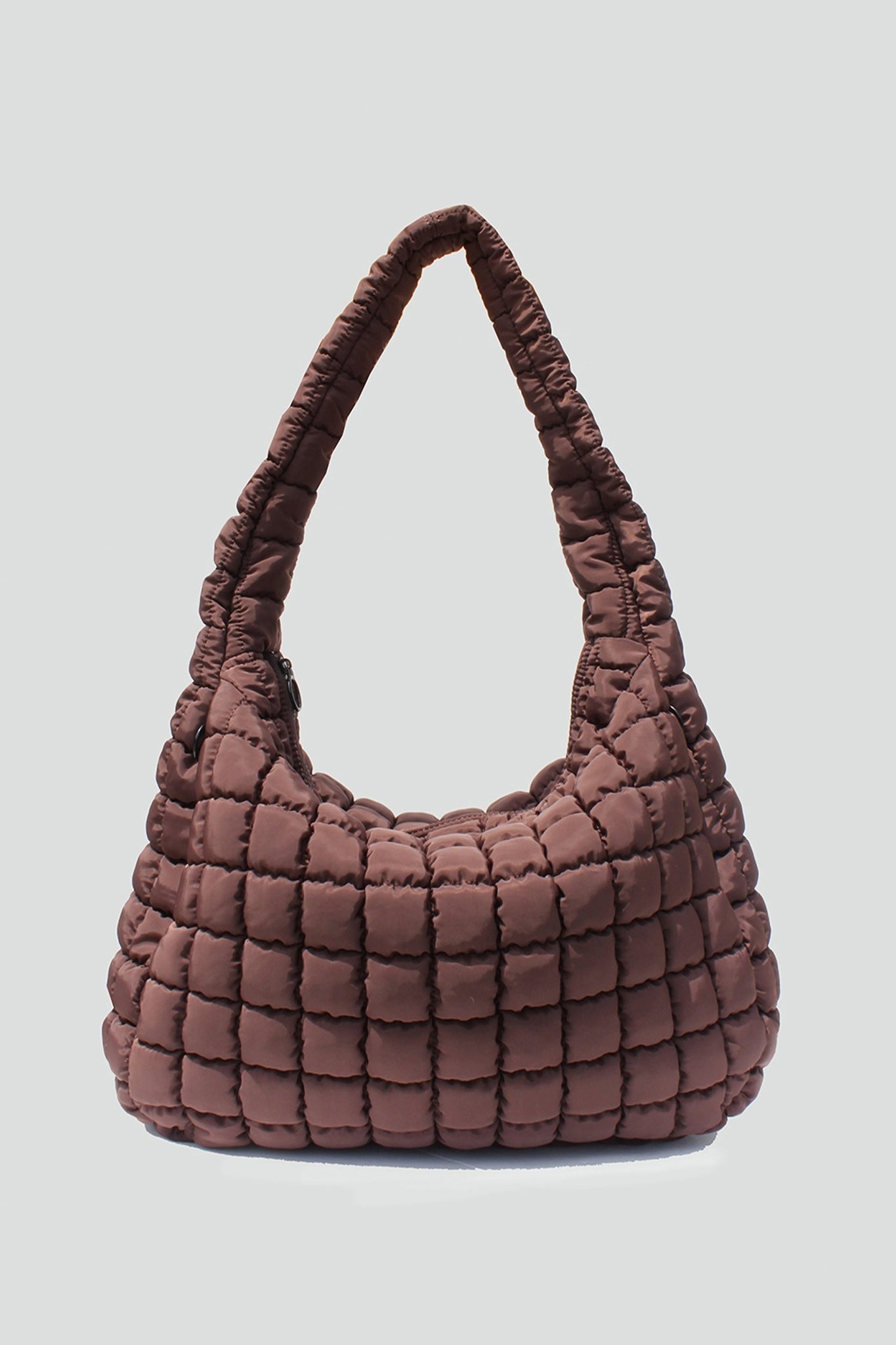 Cleo quilted hobo bag in rich chocolate brown, perfect for boho coastal adventures. Discover Larrea Cove's new arrivals collection.