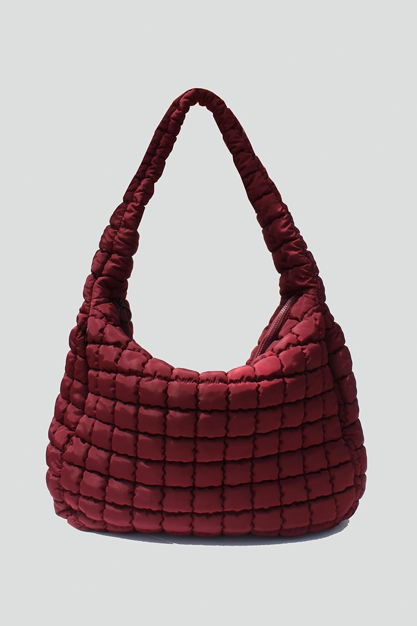 Embrace coastal chic with Larrea Cove's Cleo quilted hobo bag in rich plum, perfect for effortless boho style.