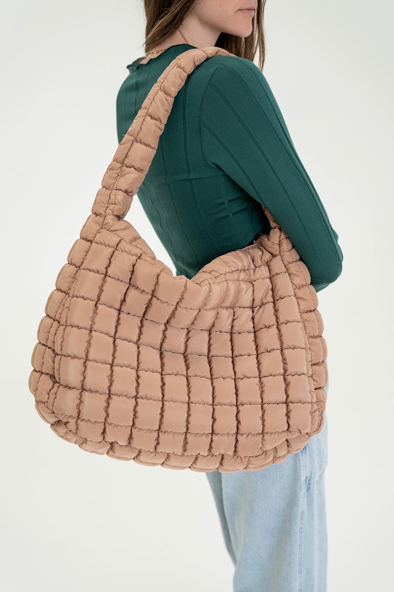 View 1 of Cleo Quilted Hobo Bag in Sand, a Bags from Larrea Cove. Detail:
<div class="Flex-sc-14t19kd-0 Column-sc-4nf49i-0 A...