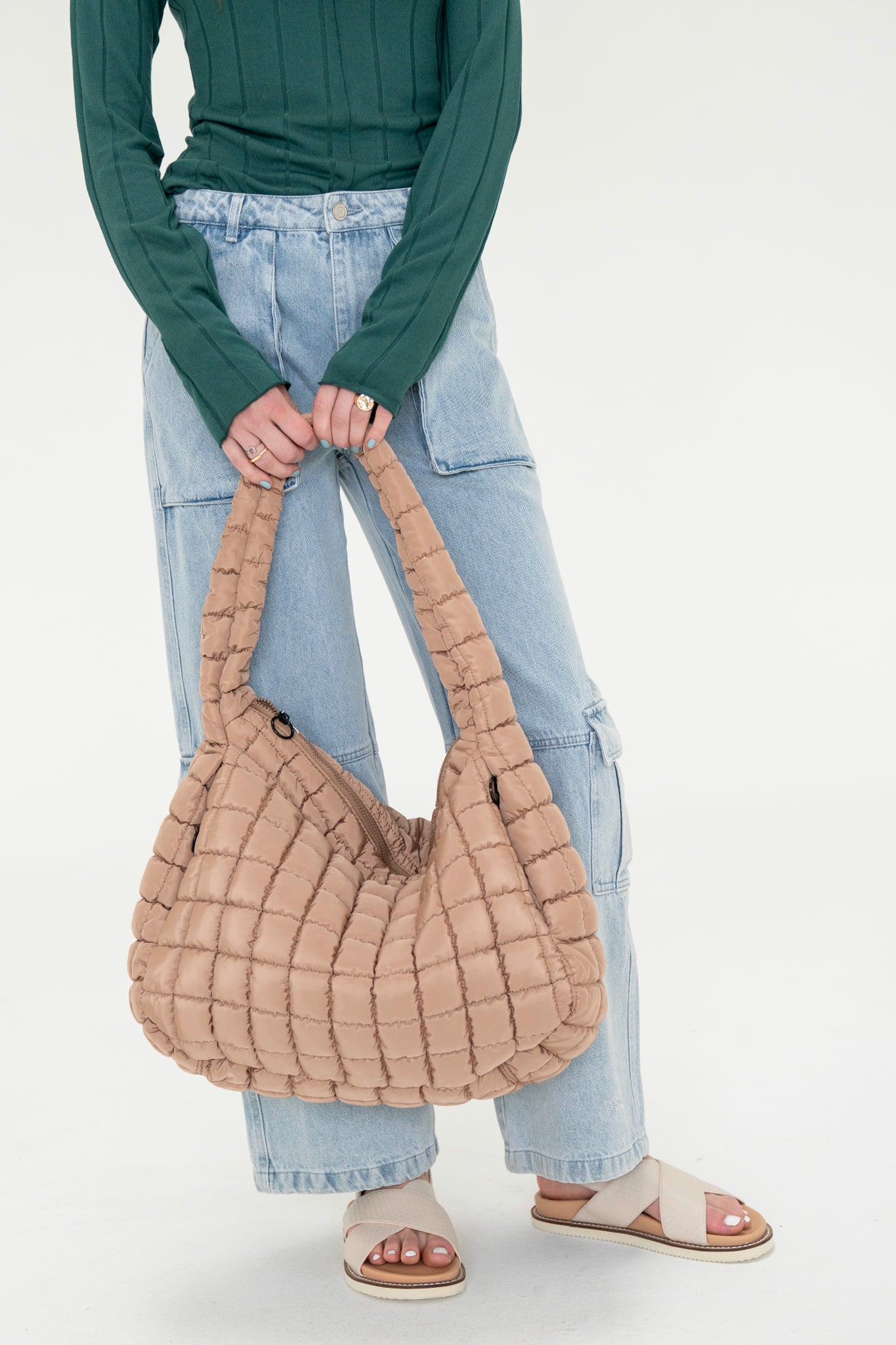Effortlessly chic Cleo quilted hobo bag in sand from Larrea Cove, perfect for neutral summer accessorizing.