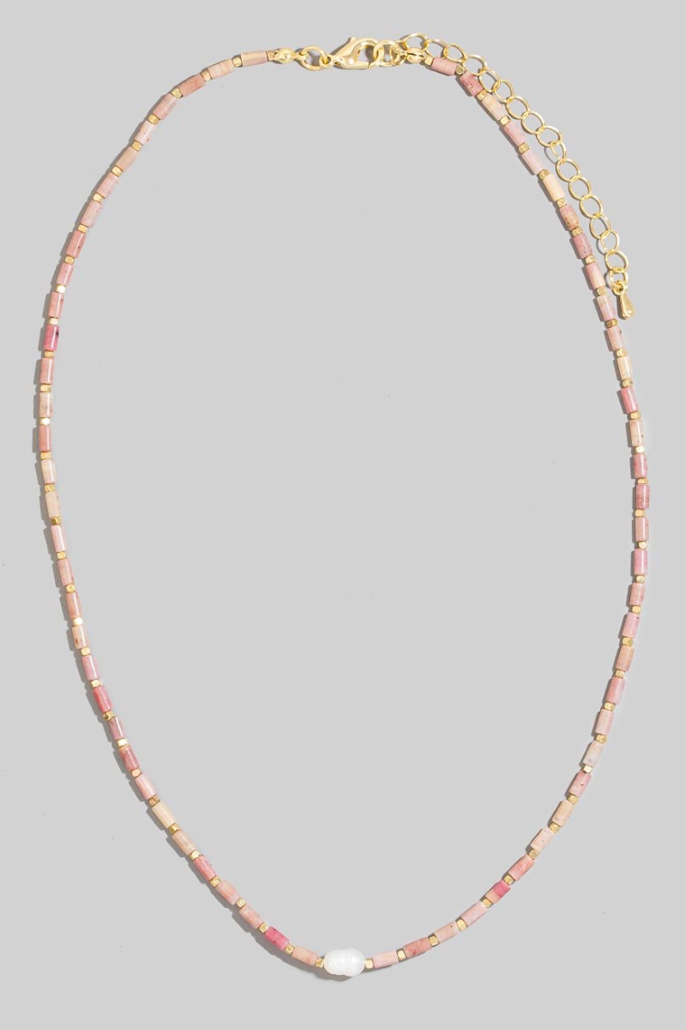 Larrea Cove's blush beaded pearl necklace exudes coastal elegance, perfect for accessorizing boho dresses and summer rompers.