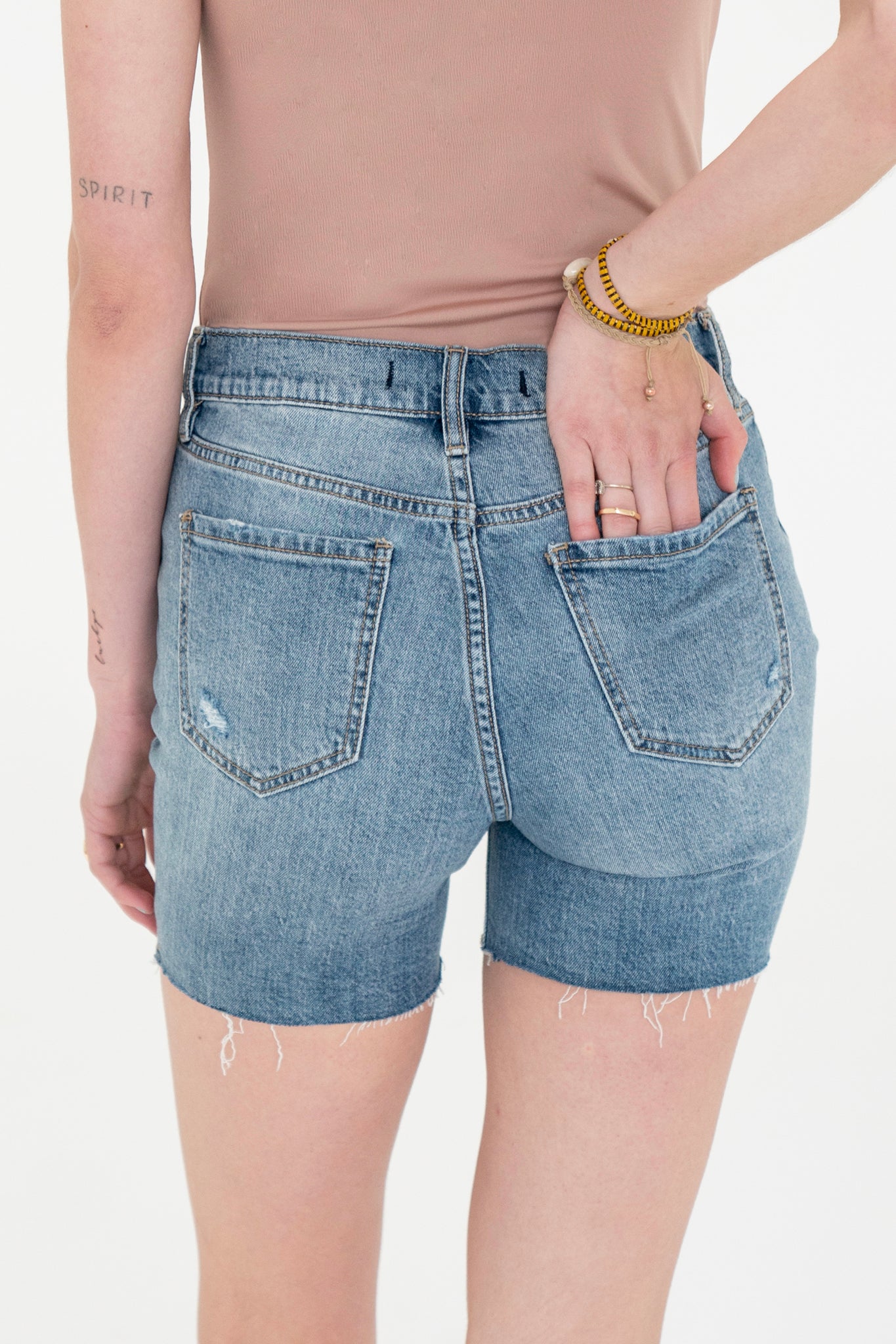 Eunina Kailey Biker Shorts in Camissonia, featuring a stylish design suitable for casual wear. The shorts are made from denim fabric and are displayed alongside a pair of chic sunglasses. Ideal for spring and summer outfits, these shorts fall under the Denim Shorts category in the Apparel & Accessories section.