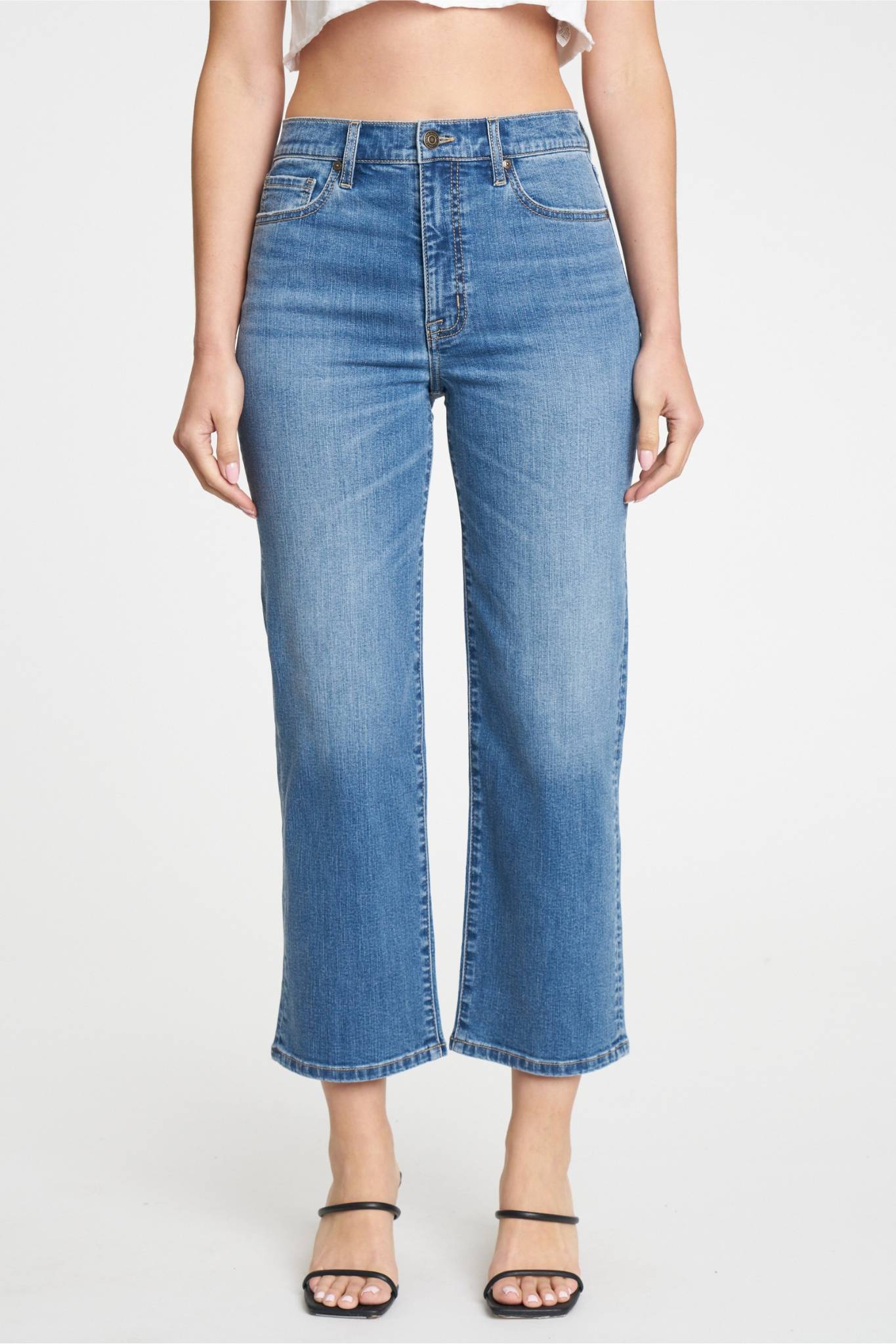 A pair of Eunina Dawn Wide Leg Jeans in Aliso, featuring a light wash and a relaxed fit. The jeans have a high waist and wide legs, giving them a trendy silhouette. Accompanying the jeans are stylish sunglasses, enhancing the casual yet chic look. The product is tagged with "Eunina," "new," and "June-2024," indicating its latest collection.