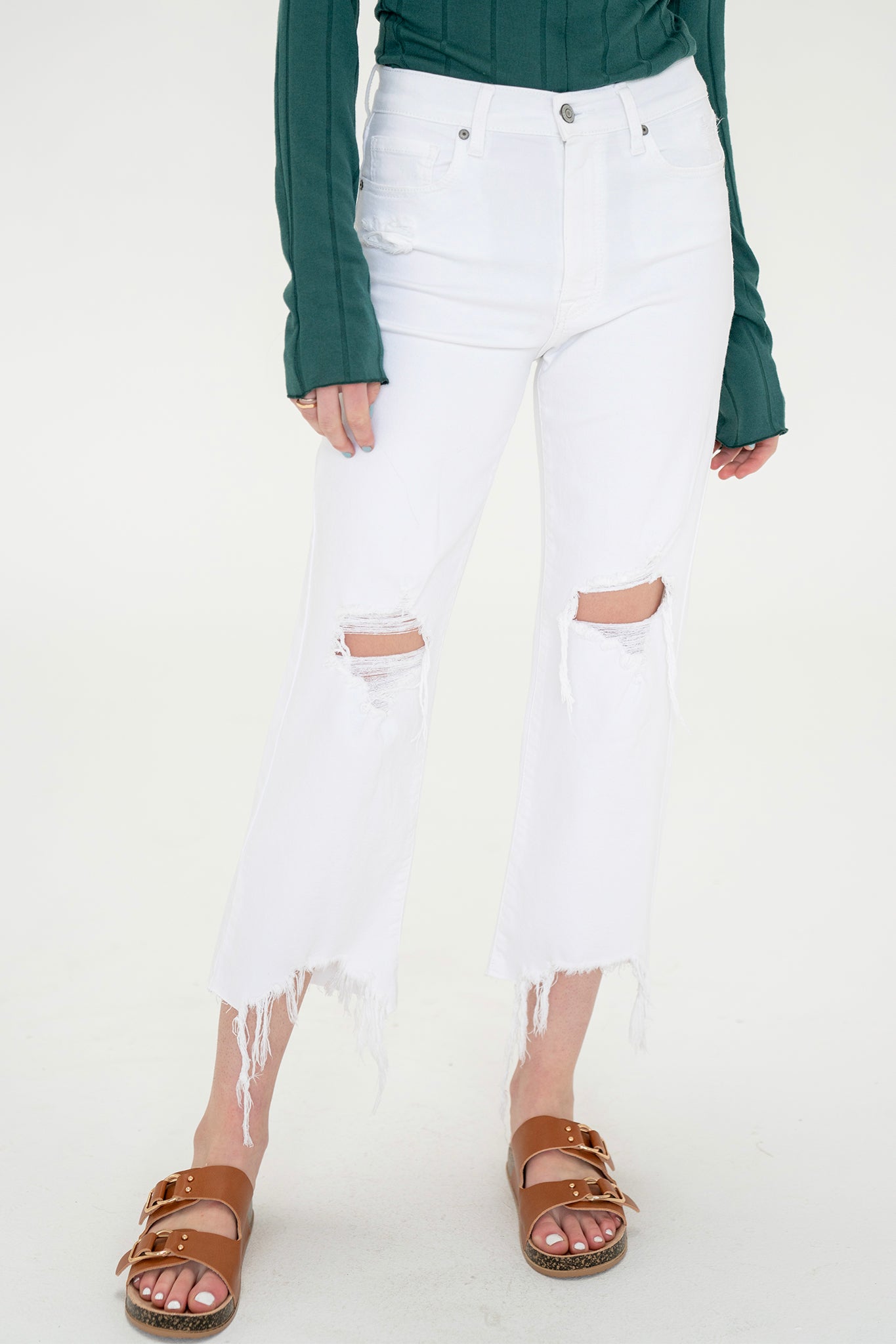 A pair of Eunina Dawn Wide Leg Jeans in Datura, featuring a light wash denim with a relaxed, wide-leg fit. The jeans are styled with a casual look, suitable for spring. Accompanying the jeans are trendy sunglasses, enhancing the fashionable presentation. This product is part of the Apparel & Accessories category, specifically under Pants.