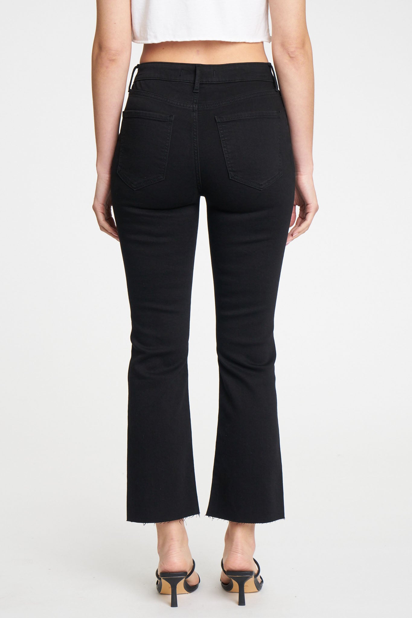Eunina Emery Cropped Boot Jeans in Desert Night, featuring a stylish cropped design and a dark, rich color. The jeans are displayed with a pair of sunglasses, emphasizing a trendy fall look. Perfect for casual wear, these jeans are part of Eunina's new collection for May 2024.