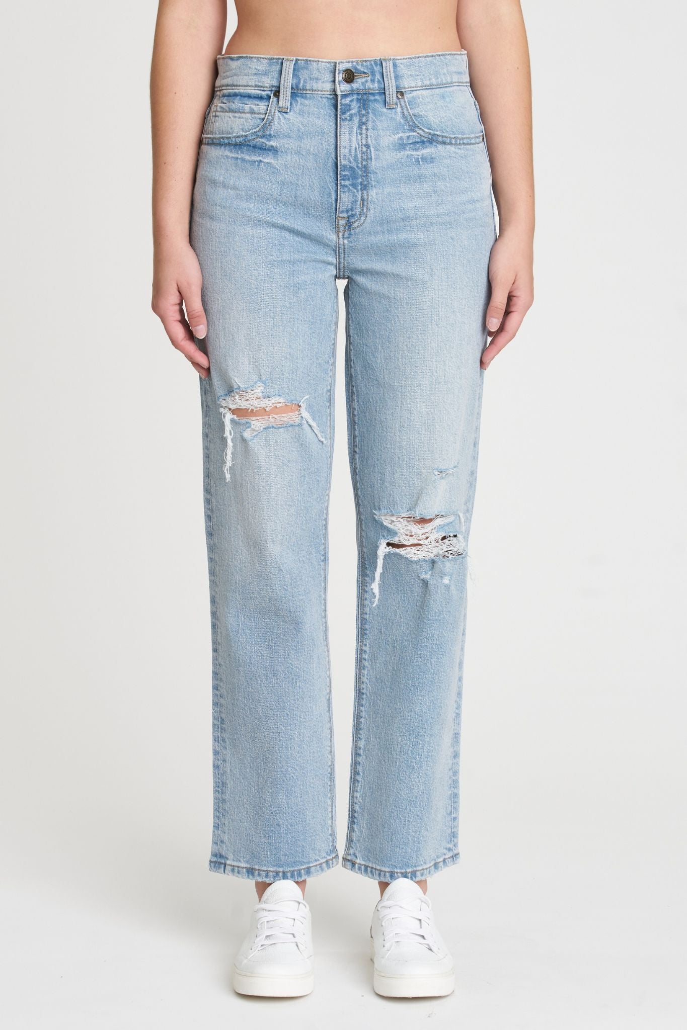 A pair of Eunina Olsen super high rise straight leg jeans in a light wash called Polem. The jeans feature distressed details, a clean hem, a five-pocket design, belt loops, and a hidden zip fly with button closure. The jeans have an 11-inch super high rise and a 28.5-inch inseam.