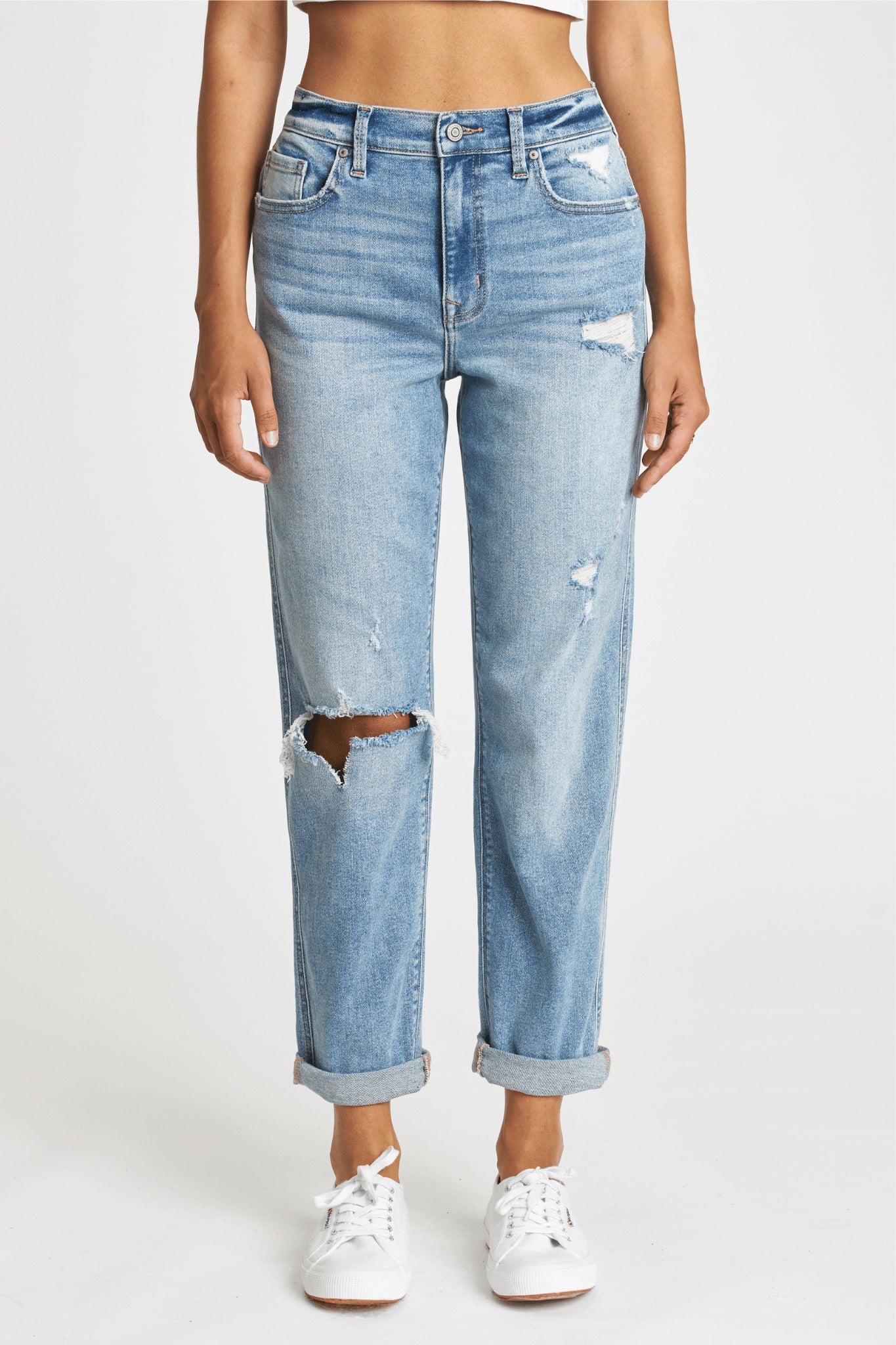Image of Eunina Rocky Boyfriend Jeans in Aster, featuring a medium wash with fading and whiskering. The jeans have an 11" high-rise, relaxed fit, and a 27" rolled inseam, complemented by a classic five-pocket design, belt loops, and a zip fly button closure. Styled casually for off-duty wear.