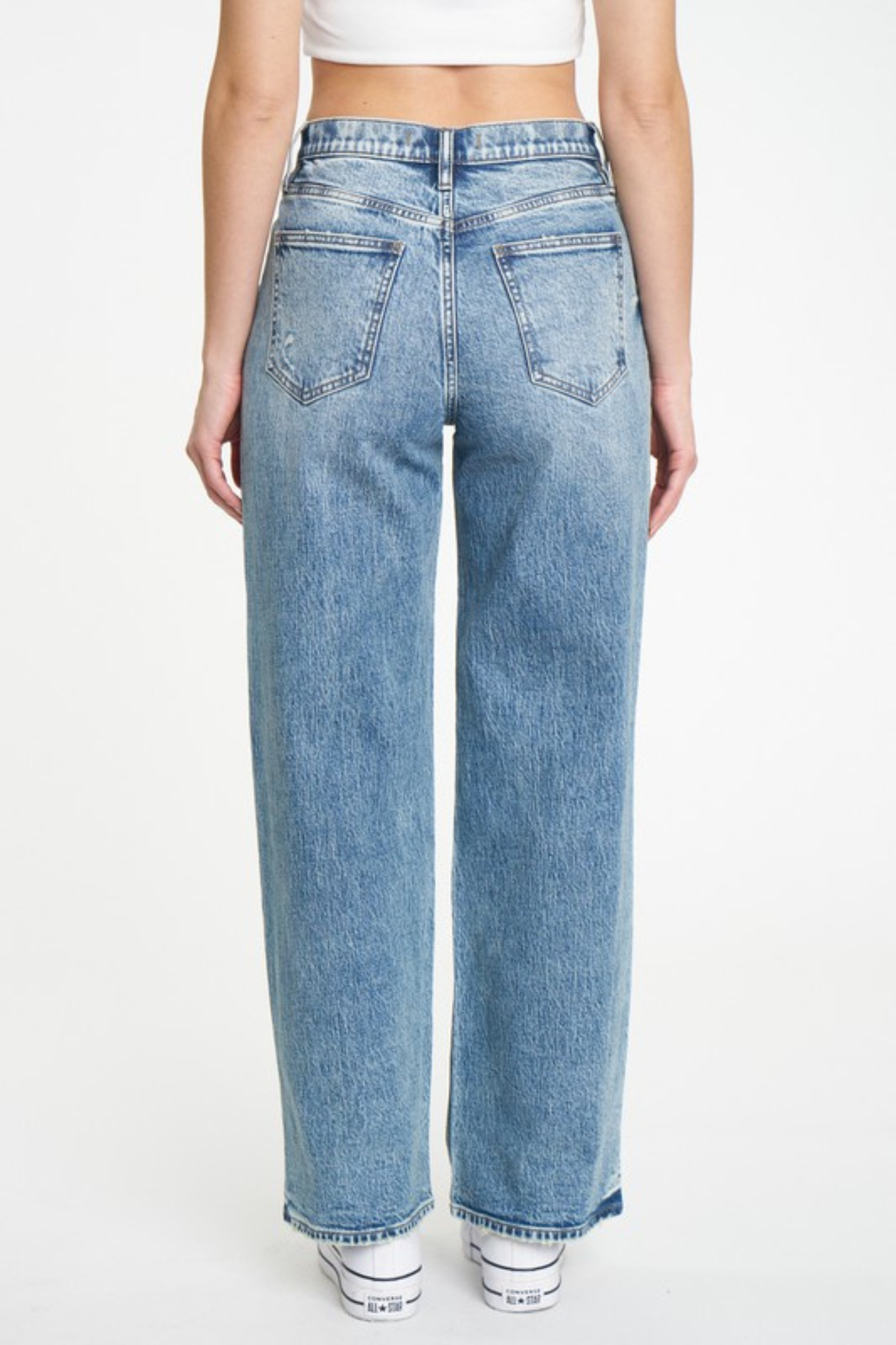 Eunina Ryder Baggy Jeans displayed outdoors in Heisler Park, styled with sunglasses. The jeans feature a relaxed fit and are part of a promotional sale by Eunina, categorized under pants in the apparel and accessories section.