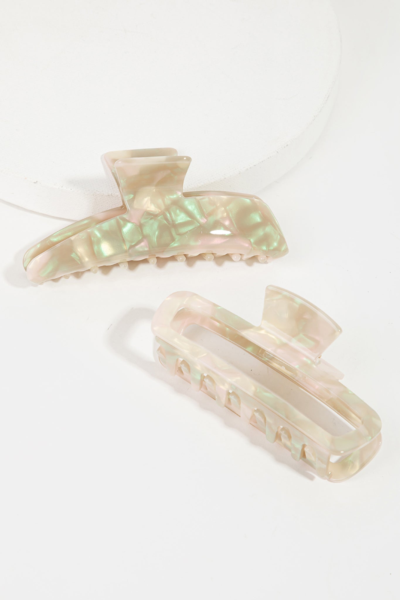 Elegant pearly white rectangle claw hair clip from Larrea Cove, perfect accessory for a boho coastal look.