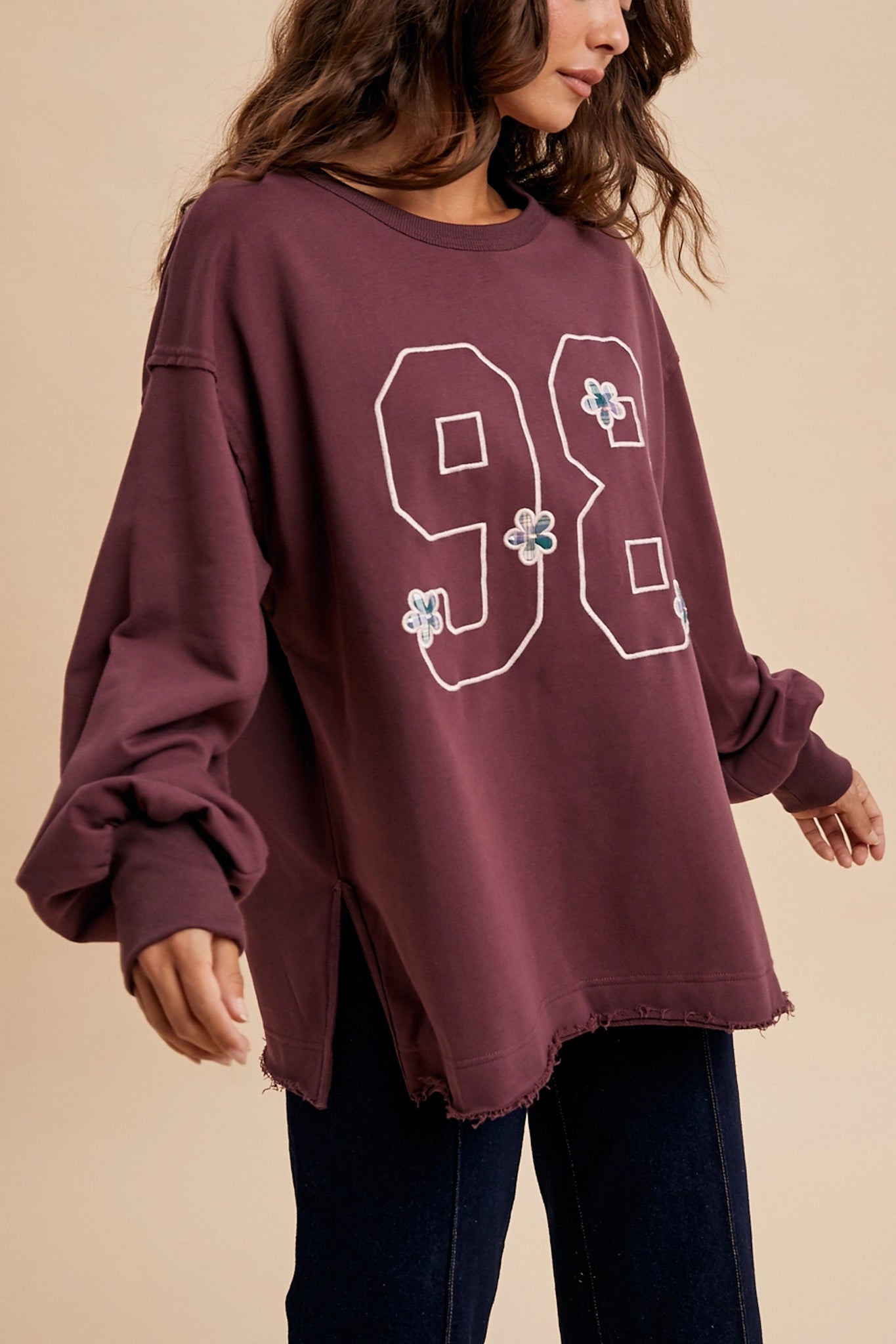 Embrace the boho coastal vibe with Larrea Cove's vintage varsity oversized pullover in rich plum, from our new arrivals.
