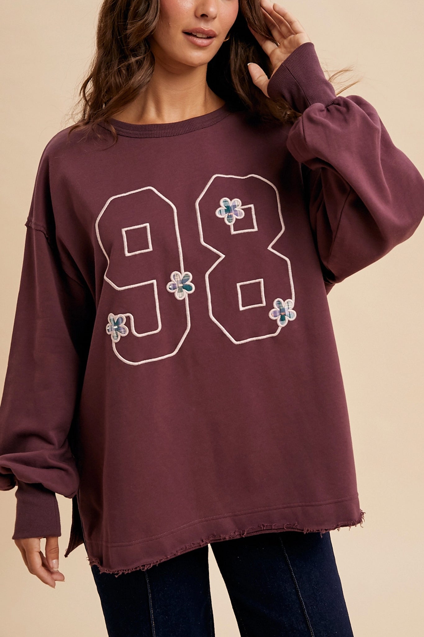 Vintage varsity oversized pullover in a deep plum hue, embodying Larrea Cove's boho coastal vibe from the new arrivals collection