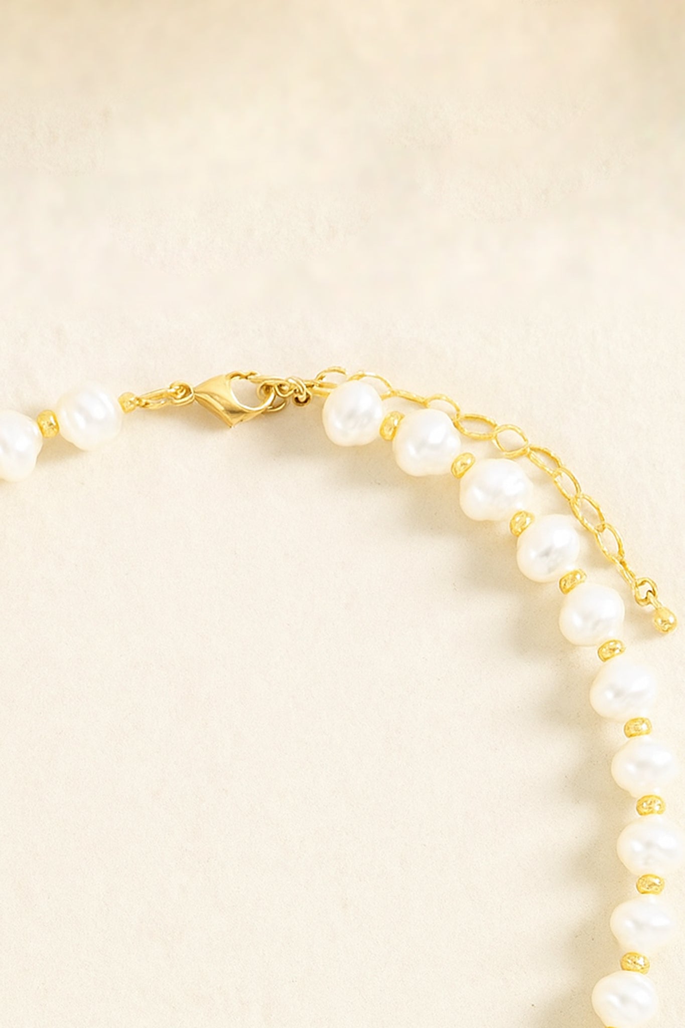 Elegant Pearl Clam Shell Charm Necklace from Larrea Cove's new-arrivals, showcasing delicate craftsmanship in coastal-inspired jewelry accessory.