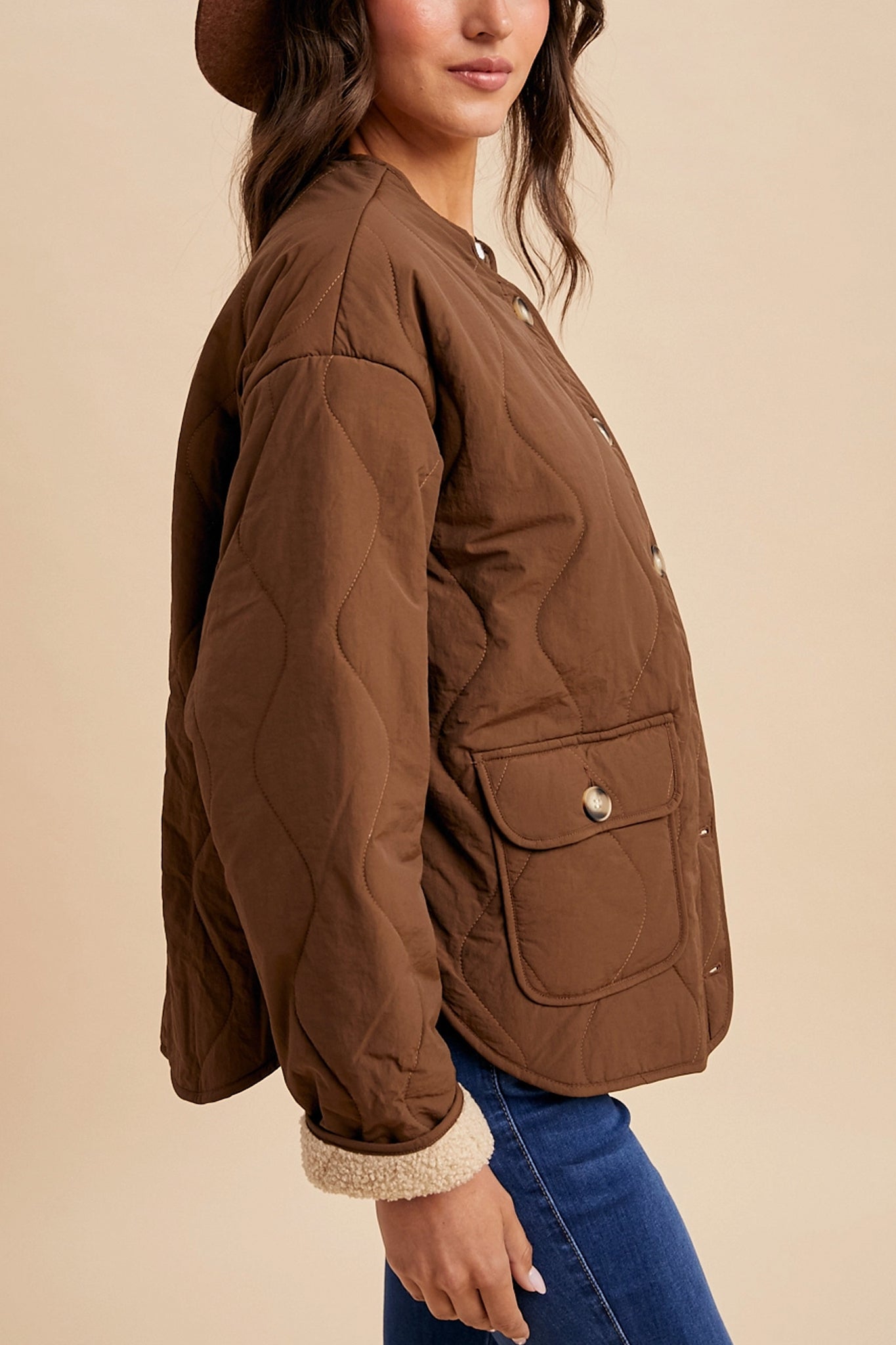 Embrace cozy coastal vibes with the Highland Sherpa-Lined Quilted Jacket in chestnut, a new arrival in Larrea Cove's outerwear collection.