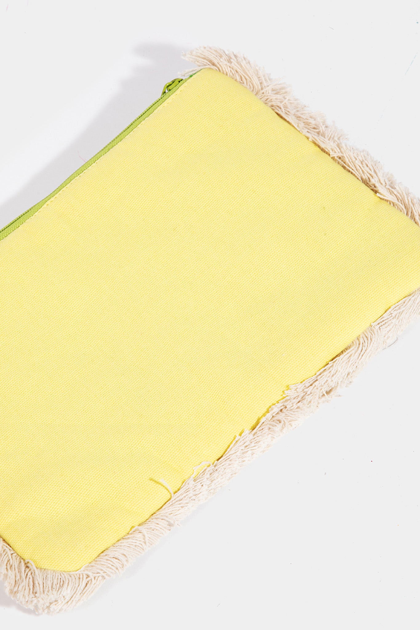 A stylish Summer Citrus Jute Clutch by ANTIK KRAFT, featuring a vibrant design with citrus-inspired colors. The clutch is made from natural jute material and includes a decorative element that reflects a summery aesthetic. It is paired with trendy sunglasses, suggesting a chic summer accessory ensemble. The image represents a new product for Summer 2024, categorized under Clutch Bags within the Apparel & Accessories section.