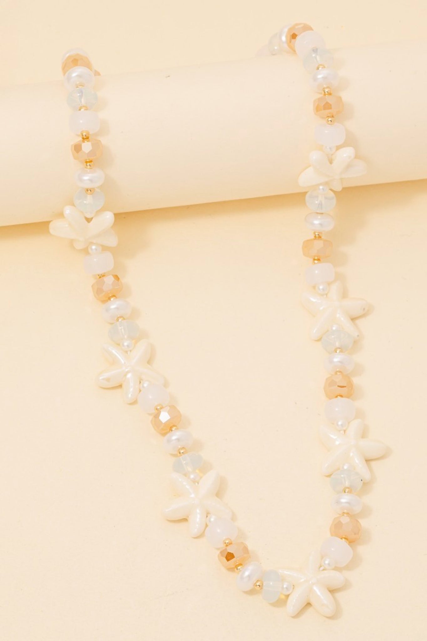 Starfish bead necklace from Larrea Cove's new arrivals, featuring intricate beaded details perfect for a coastal boho vibe.