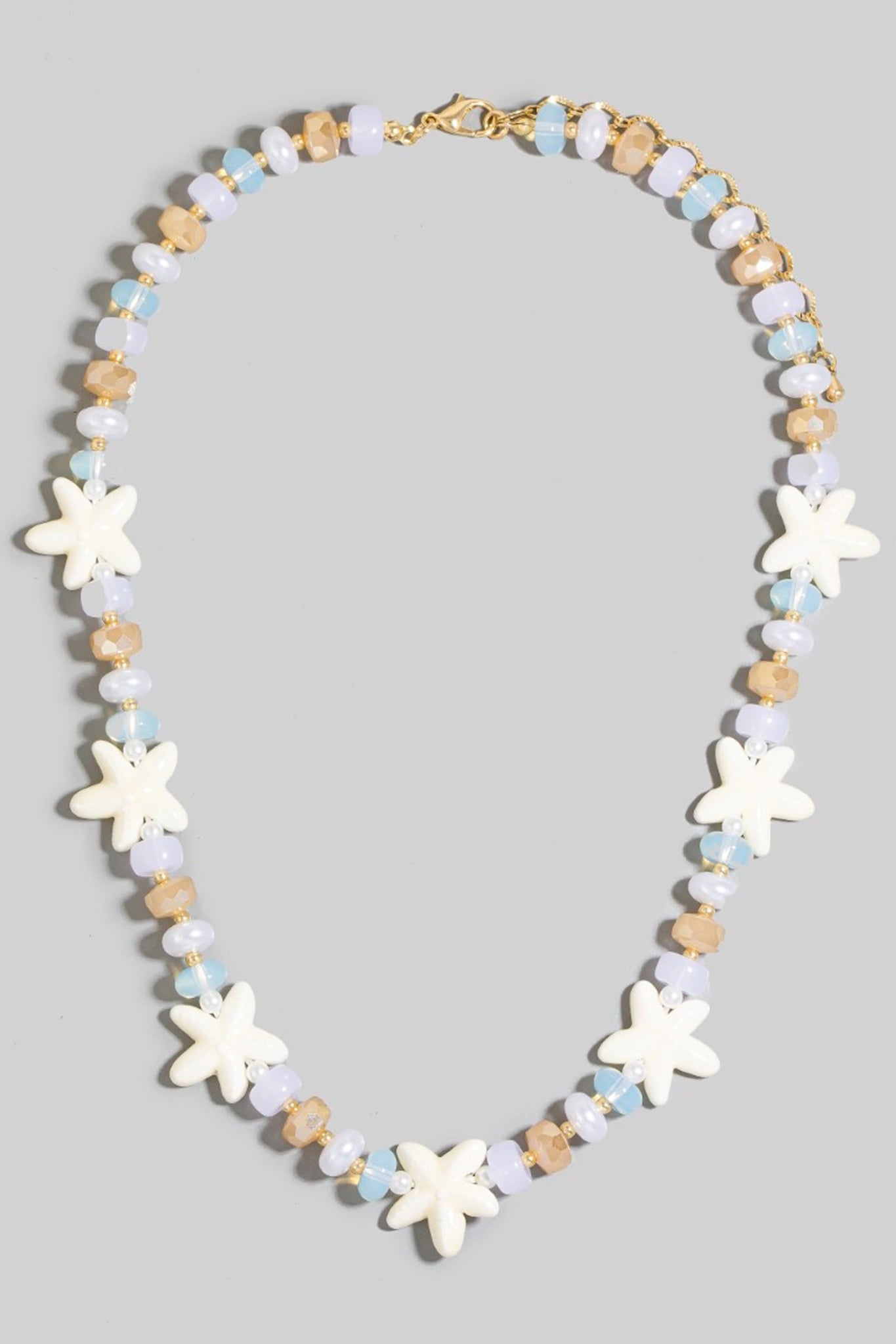 Larrea Cove's starfish bead necklace sparkles with coastal charm, a new arrival in our boho jewelry collection, perfect for ocean-inspired accessorizing.