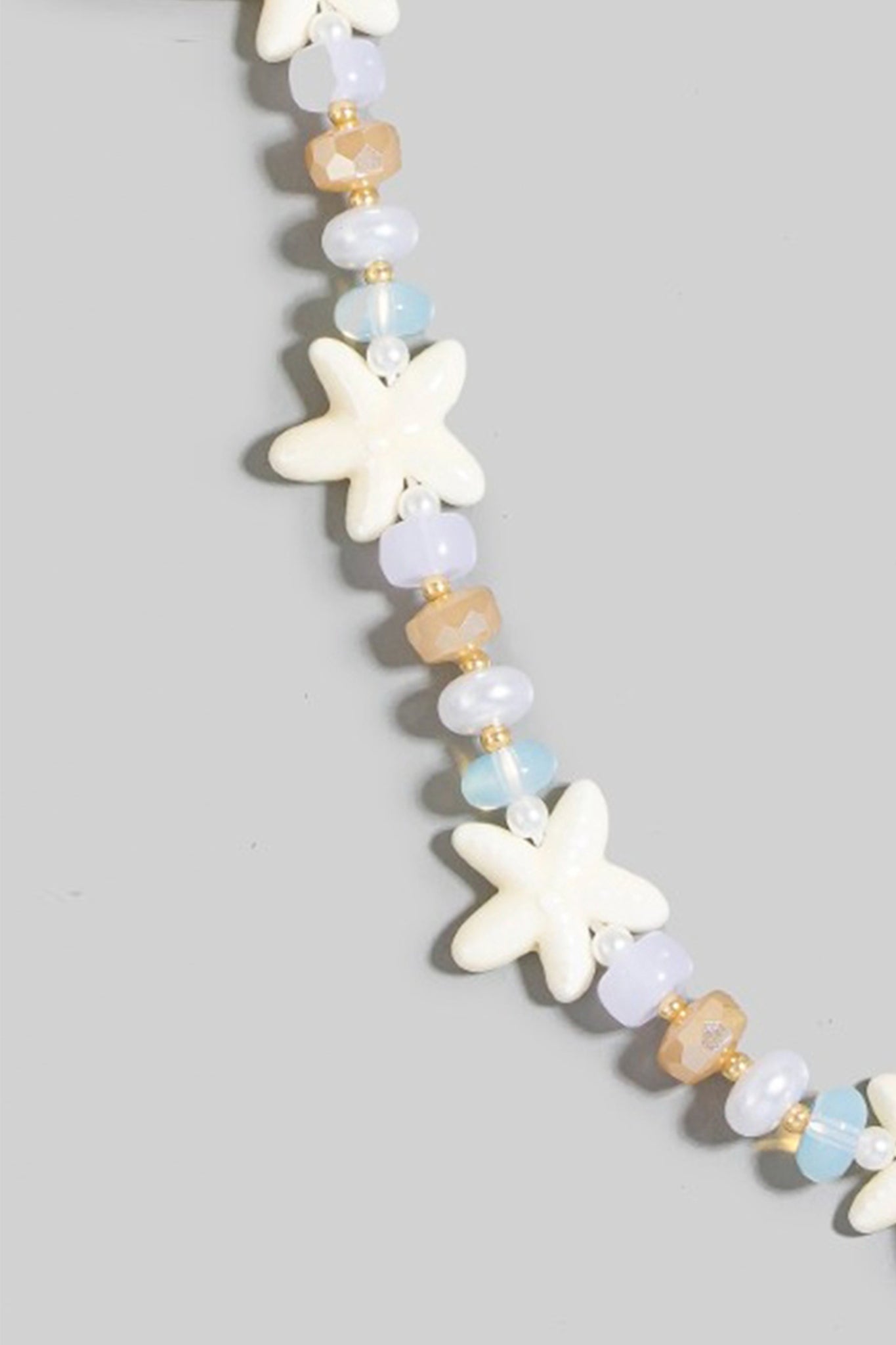 Starfish bead necklace from Larrea Cove, featuring delicate ocean-inspired detailing, perfect as a boho coastal accessory.