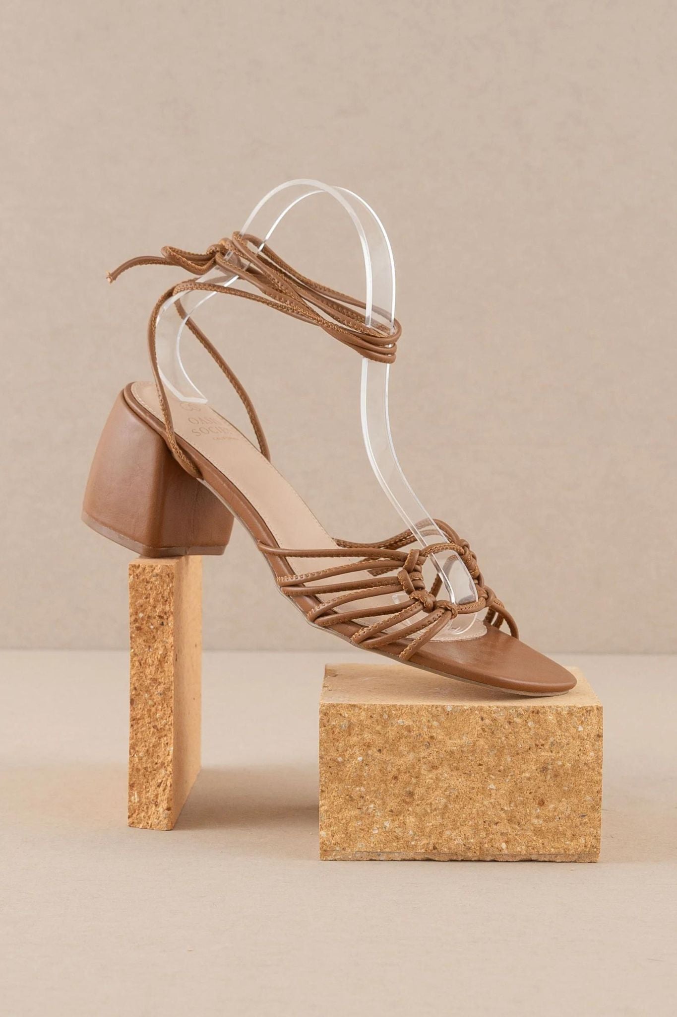 Celia Brown Knotted Lace Up Heel by Oasis Society, featuring a stylish brown design with a knotted detail and lace-up straps. Ideal for summer 2024, showcasing a trendy and fashionable look.