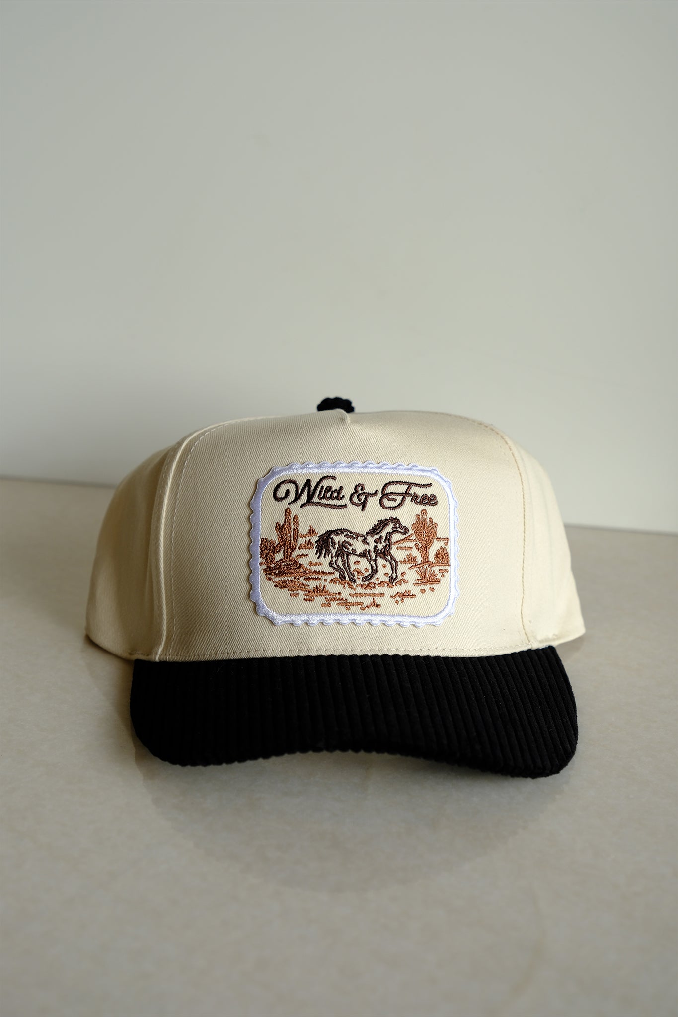 Embrace coastal vibes with the Wild & Free black corduroy brim baseball cap from Larrea Cove's new arrivals collection.