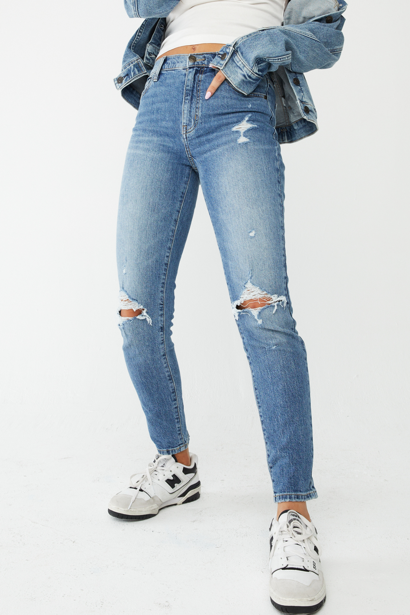 Eunina Tobi Mom Jeans in Whipple, featuring a relaxed fit and light wash denim. Accompanied by stylish sunglasses, the jeans are part of the 2024 collection from Eunina, categorized under Pants in Apparel & Accessories.