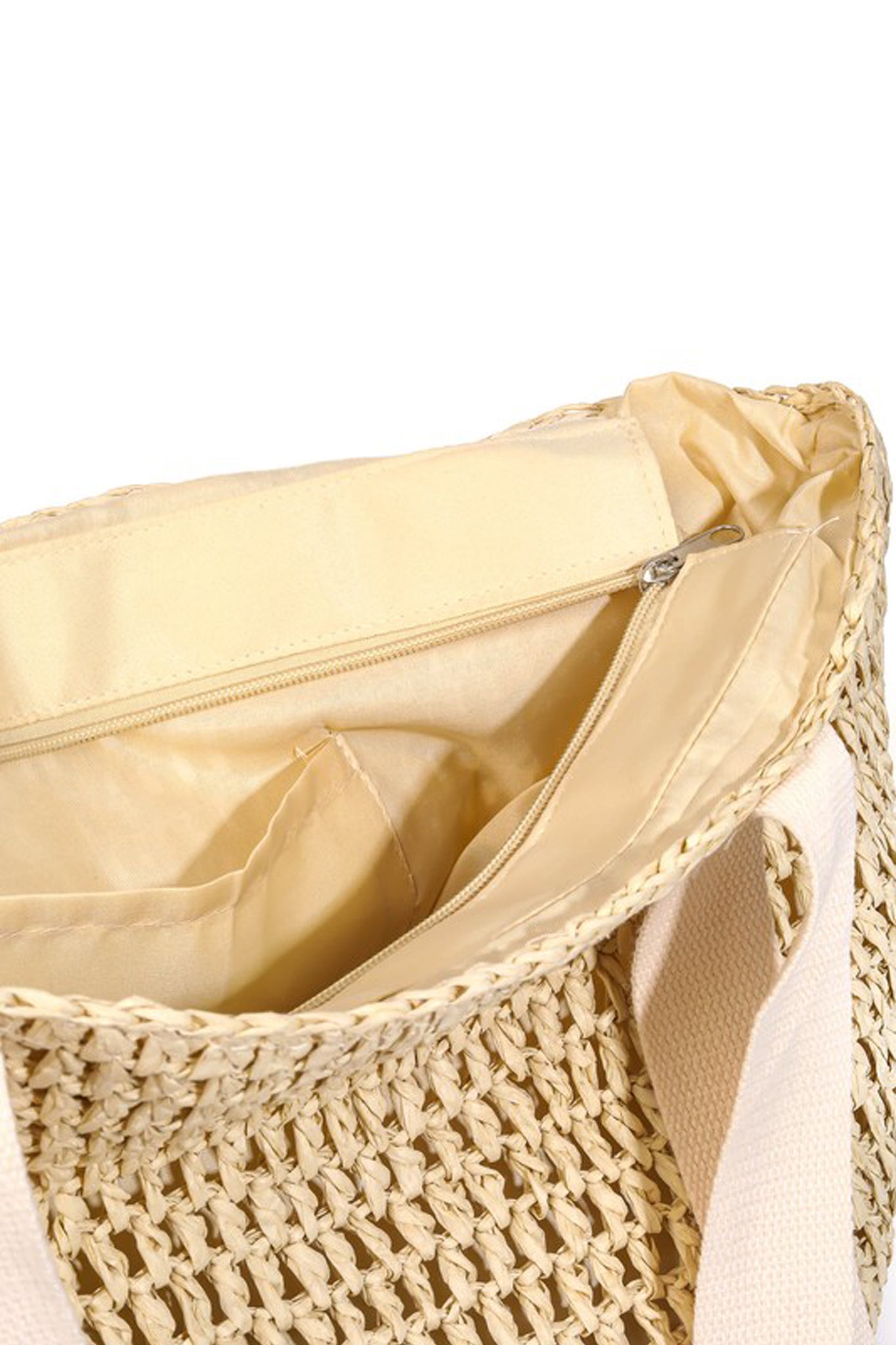 A beige Ironwood Bag by Larrea Cove, featuring a stylish design suitable for summer. The bag is part of the new collection and is tagged with relevant seasonal and promotional information. Perfect for accessorizing any outfit.