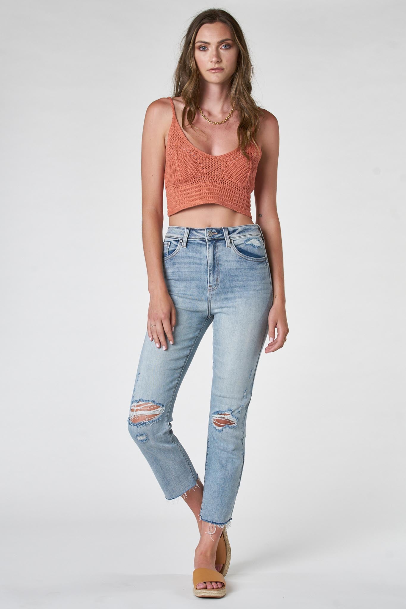 A pair of Eunina Ally Straight Jeans in a Saguaro color, featuring a classic straight-leg cut and a mid-rise waist. The jeans have a clean, modern design suitable for casual wear. Accompanying the jeans are stylish sunglasses, emphasizing a fashionable outfit.
