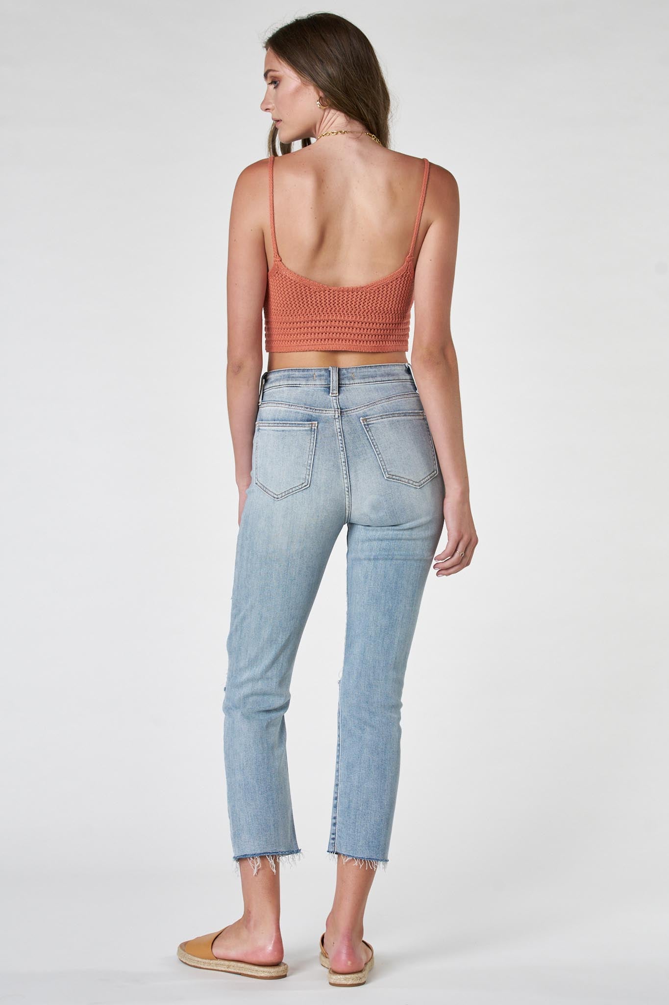Eunina Ally Straight Jeans in Saguaro, featuring a classic straight-leg design in a light green color. The jeans are styled with a casual look, perfect for everyday wear. Accompanying the jeans are sunglasses, enhancing the outfit's trendy appeal.