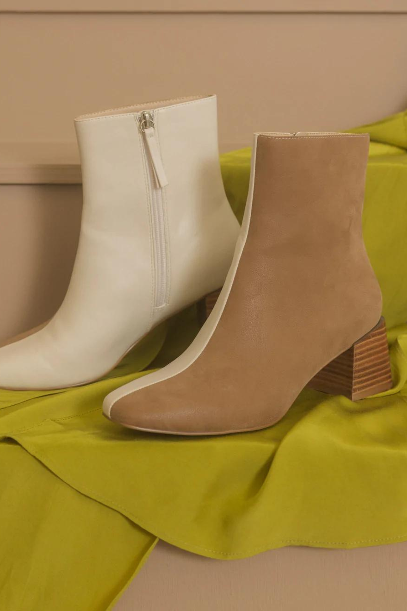Oasis Society Georgia Dual Chroma Bootie, a stylish pair of shoes featuring a modern design with dual-tone colors. Accompanied by sunglasses, showcasing a trendy and chic fashion ensemble. Part of the new product line launched in September 2022, currently on sale.