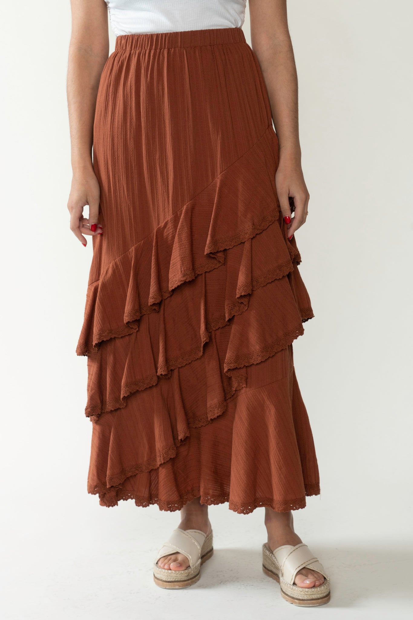 View 1 of Aviv Tiered Maxi Skirt, a Skirts from Larrea Cove. Detail: 
 With its asymmetri...