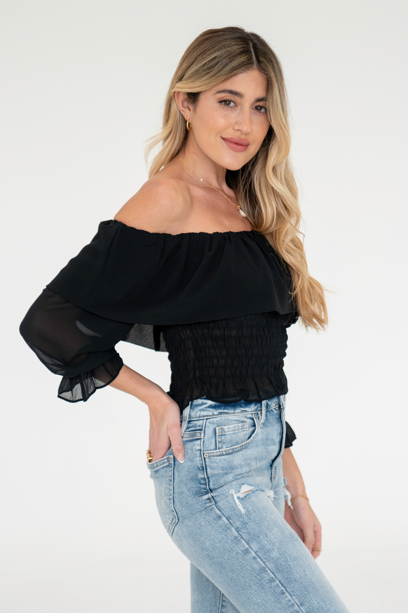 View 1 of Boa Off Shoulder Top, a Tops from Larrea Cove. Detail: Bring a timeless, romantic look to your wardrobe with the Boa Off Shoulder Top!...