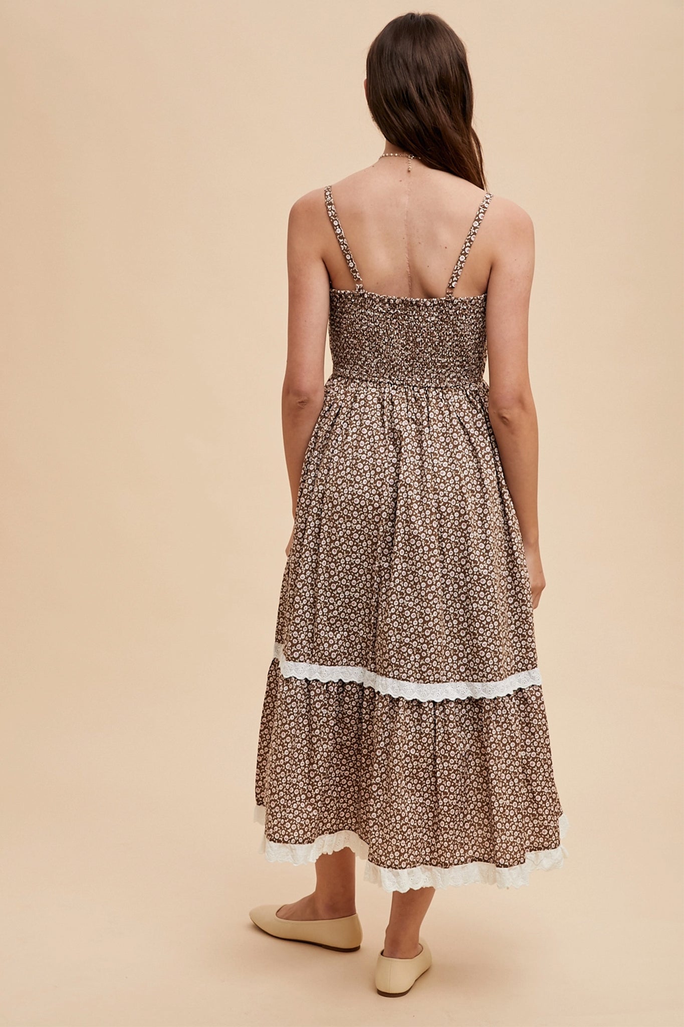 Elegant lace overlay maxi dress from Larrea Cove, showcasing boho charm with intricate detailing in the new arrivals collection.