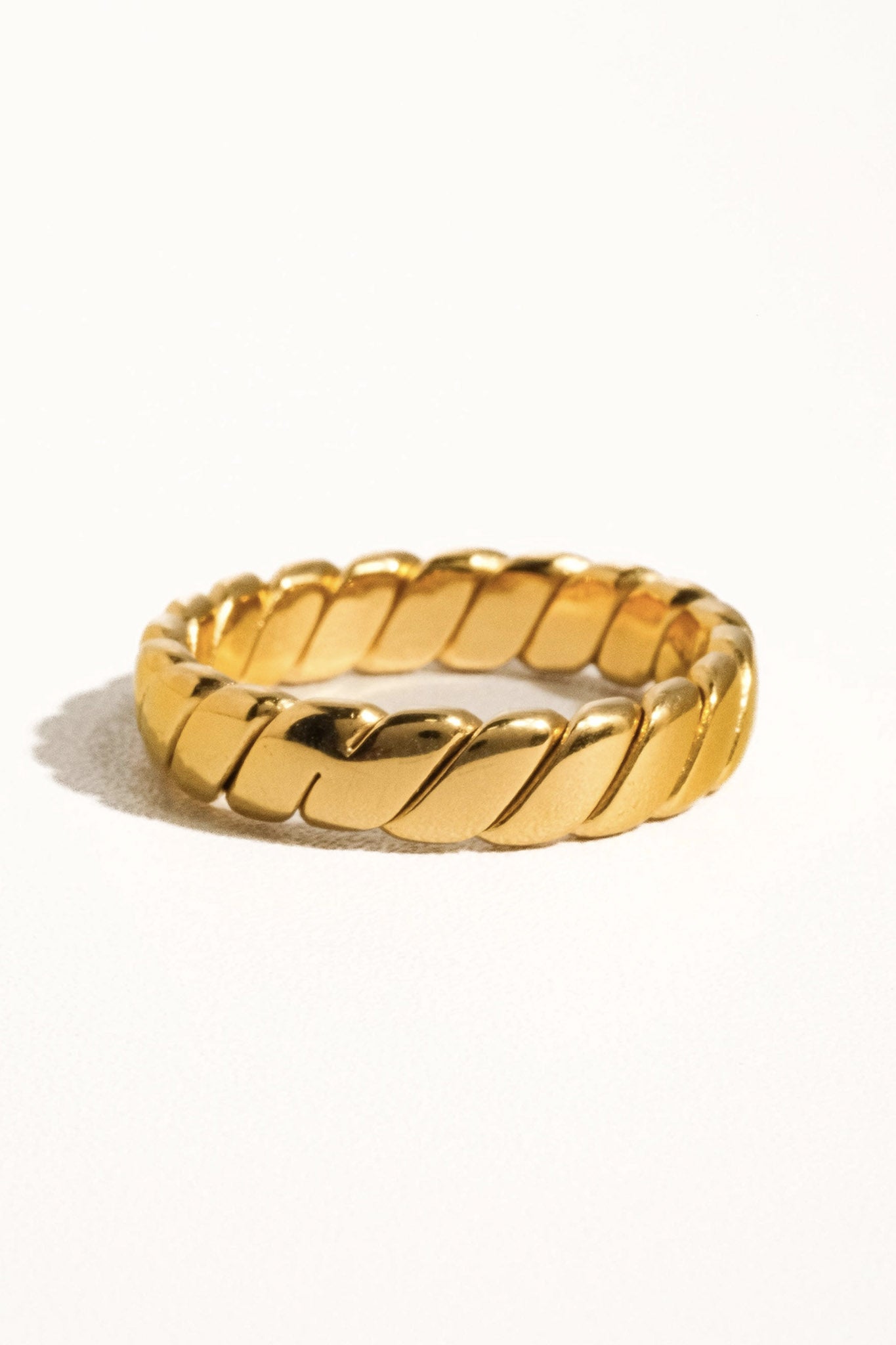Golden braid stack ring from Larrea Cove’s new arrivals, featuring intricate woven design for a boho coastal jewelry vibe.