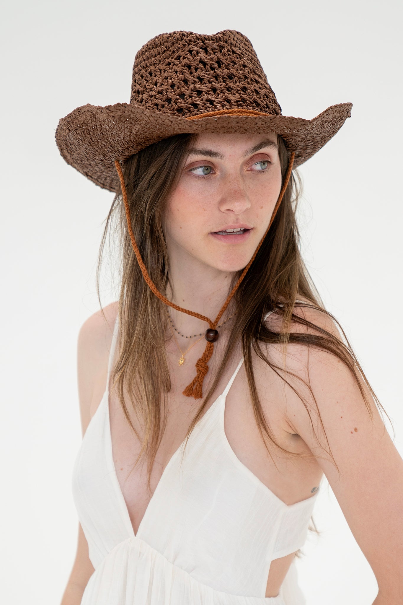 View 1 of Brown Cowboy Hat, a Hats from Larrea Cove. Detail: Get beach-ready with this awesome Brown Cowboy Hat! With its western style and straw f...
